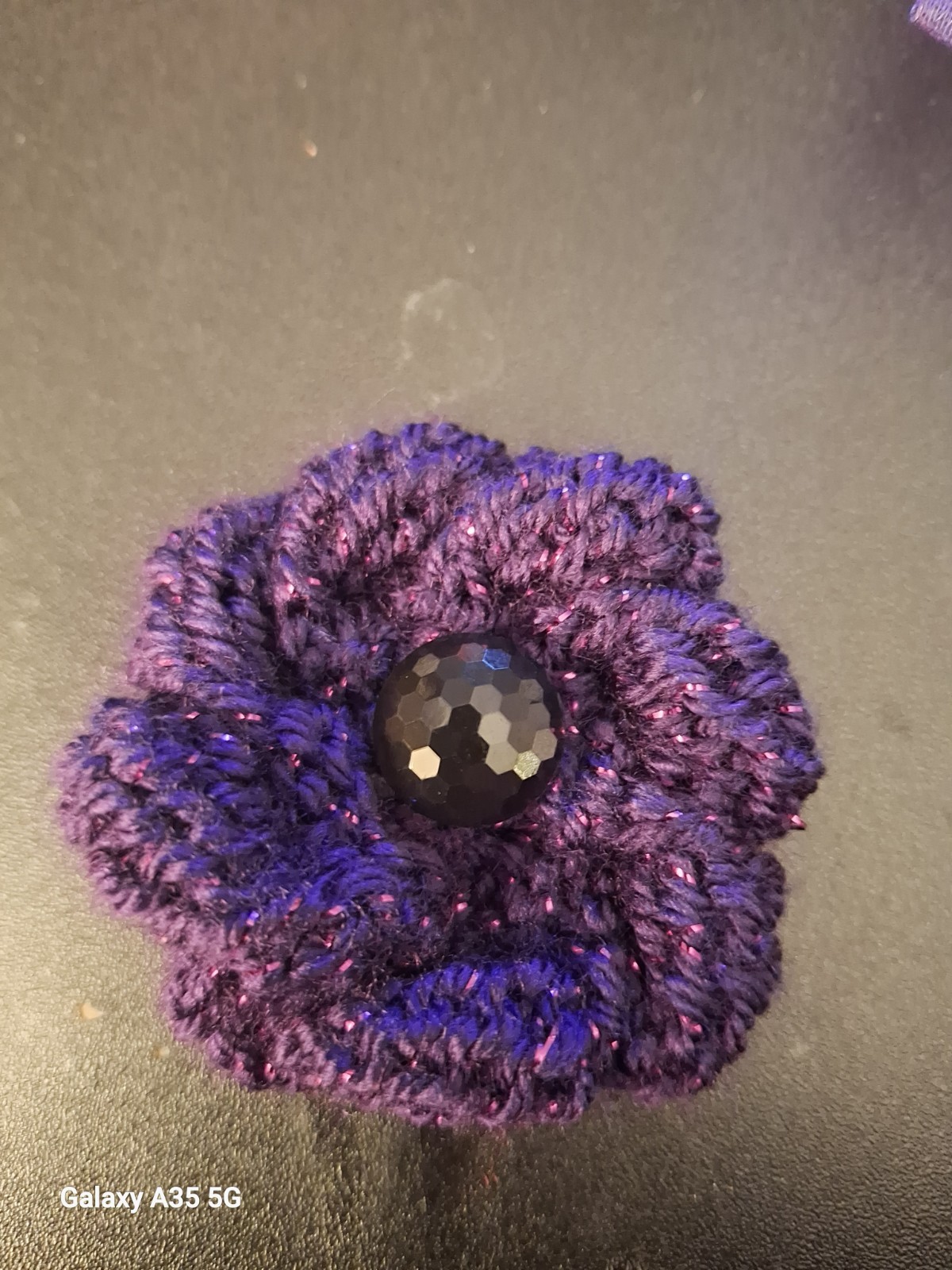 Hand knitted purple Glitter Poppy Brooch