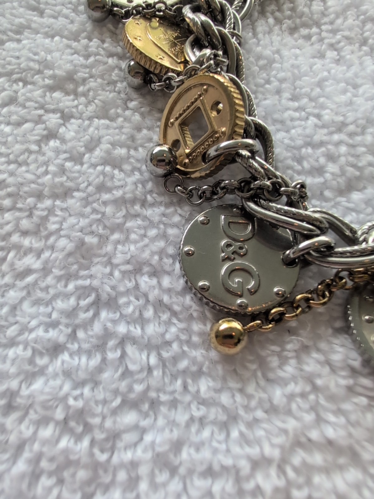 Dolce gabbana bracelet With 15 charms great condition, 8.5″ long Heavy Piece