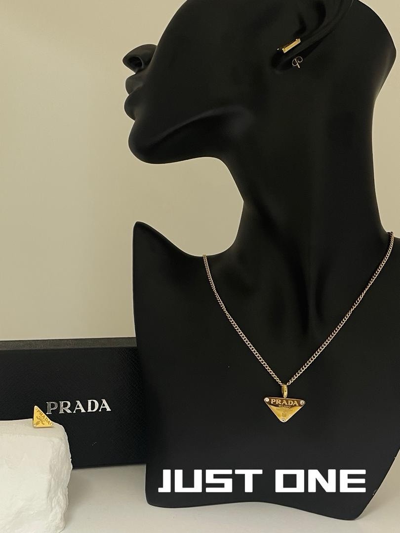 PRADA Signed Triangle Logo Charm Pendant Necklace Gold Tone on Silver Curb Chain