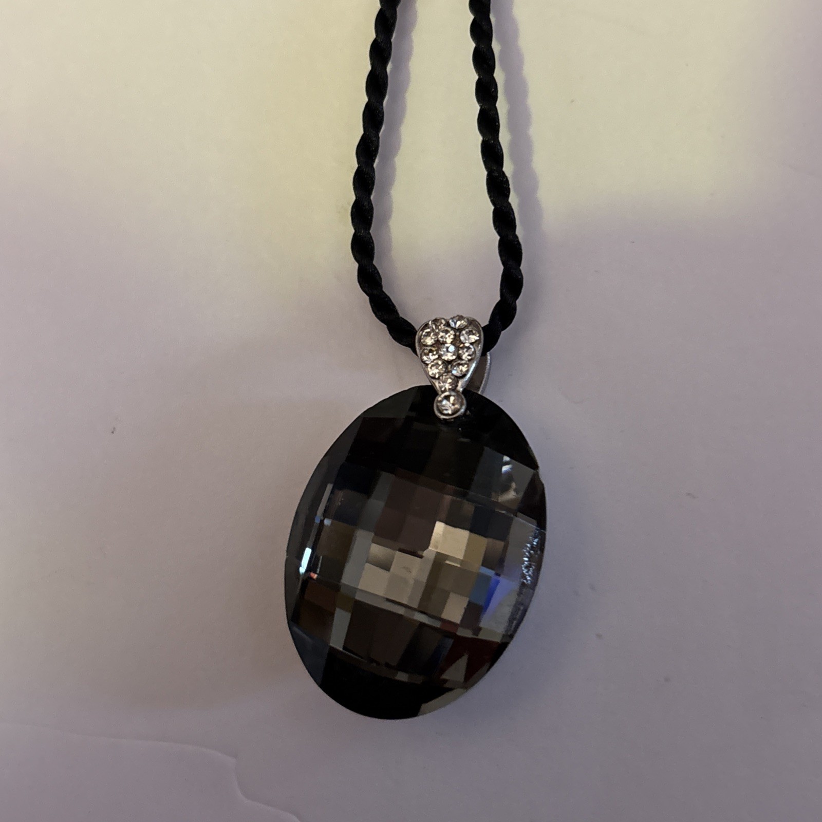 New without tags Beautiful Faceted Necklace on black soft cord