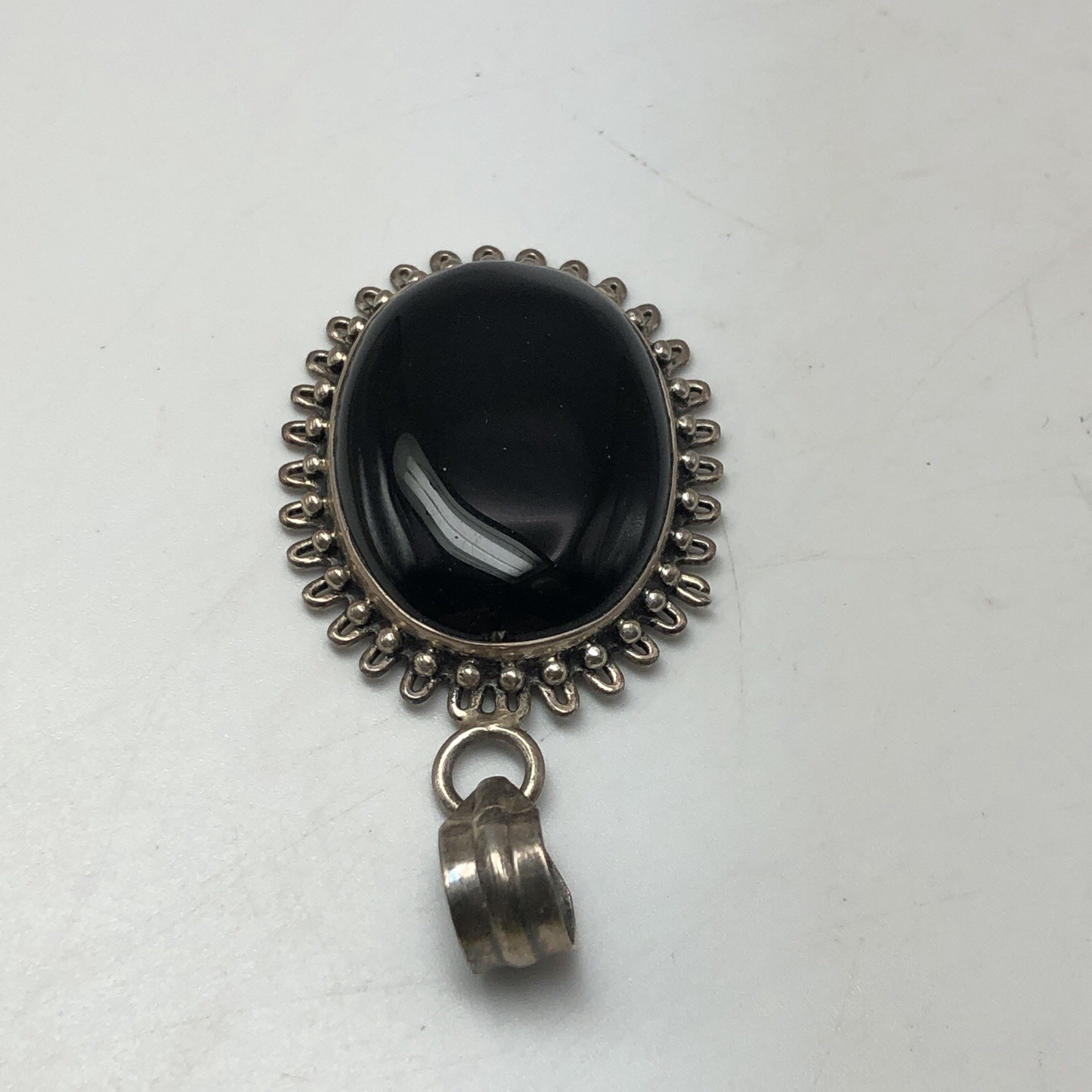 Black Onxy Oval Cabochon Pendant Bezel Set In Sterling Silver