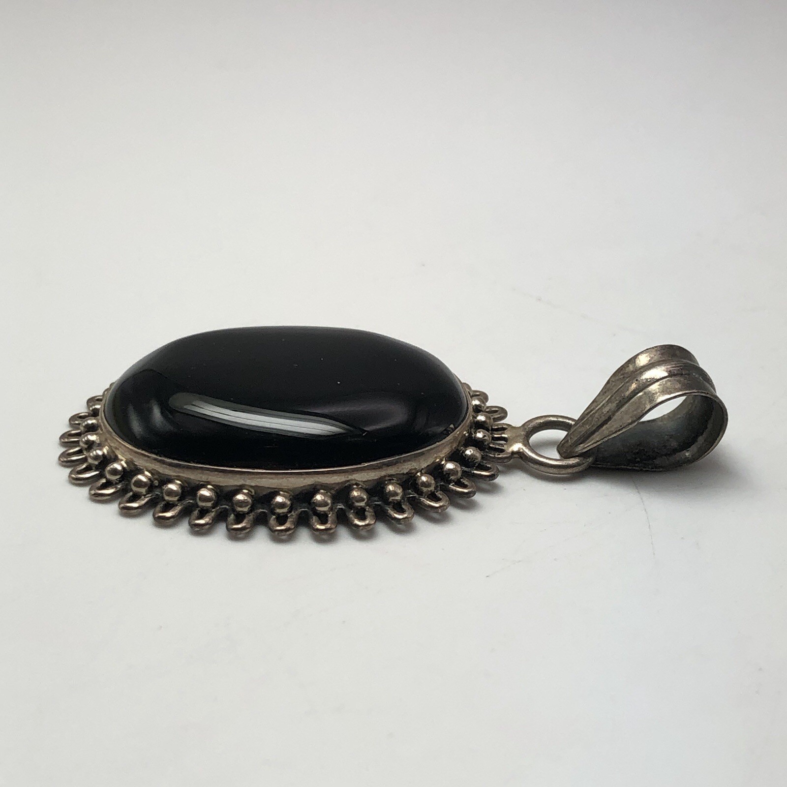 Black Onxy Oval Cabochon Pendant Bezel Set In Sterling Silver