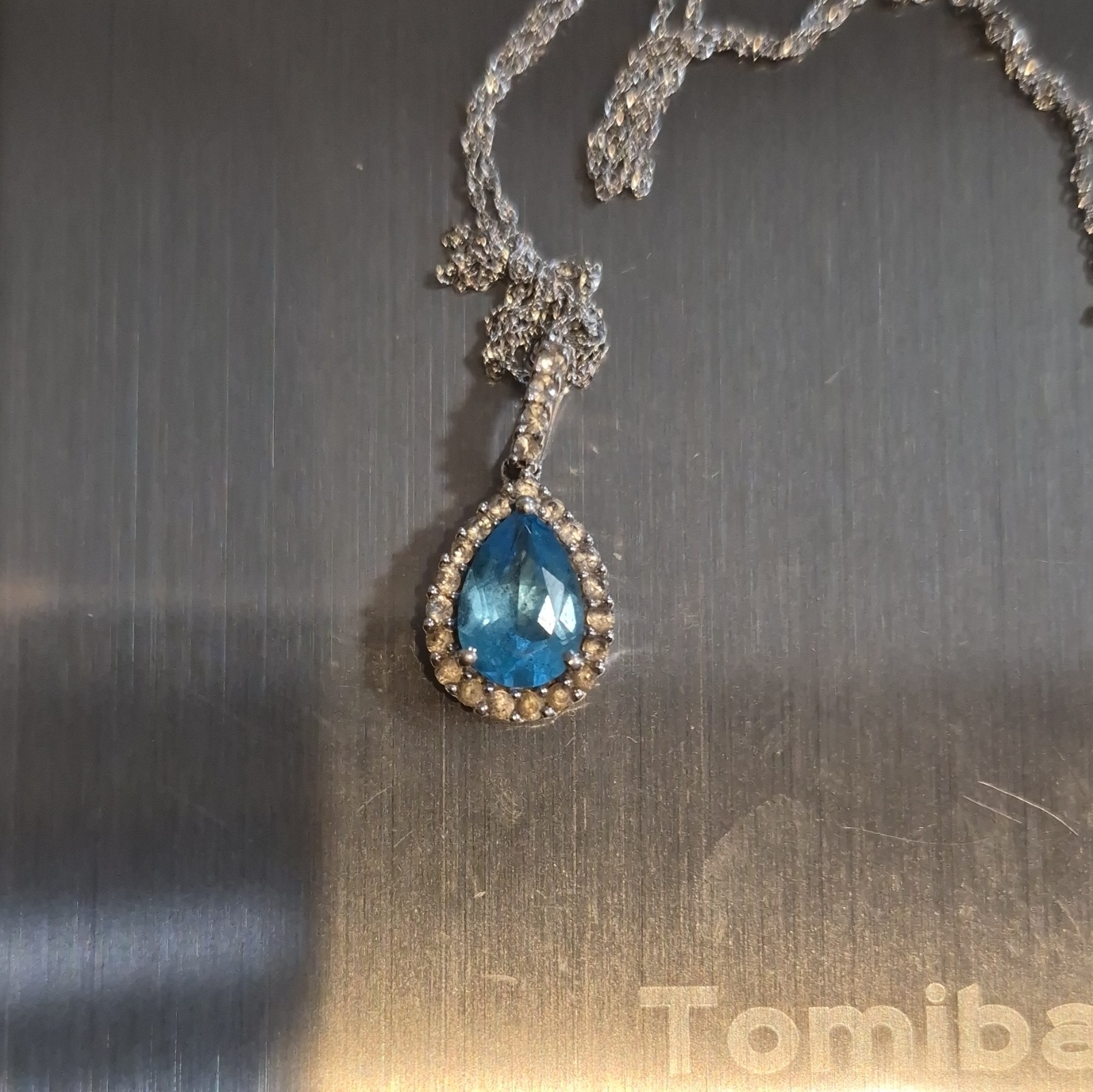 14kt white gold blue topaz and diamond accented necklace 18 inch chain