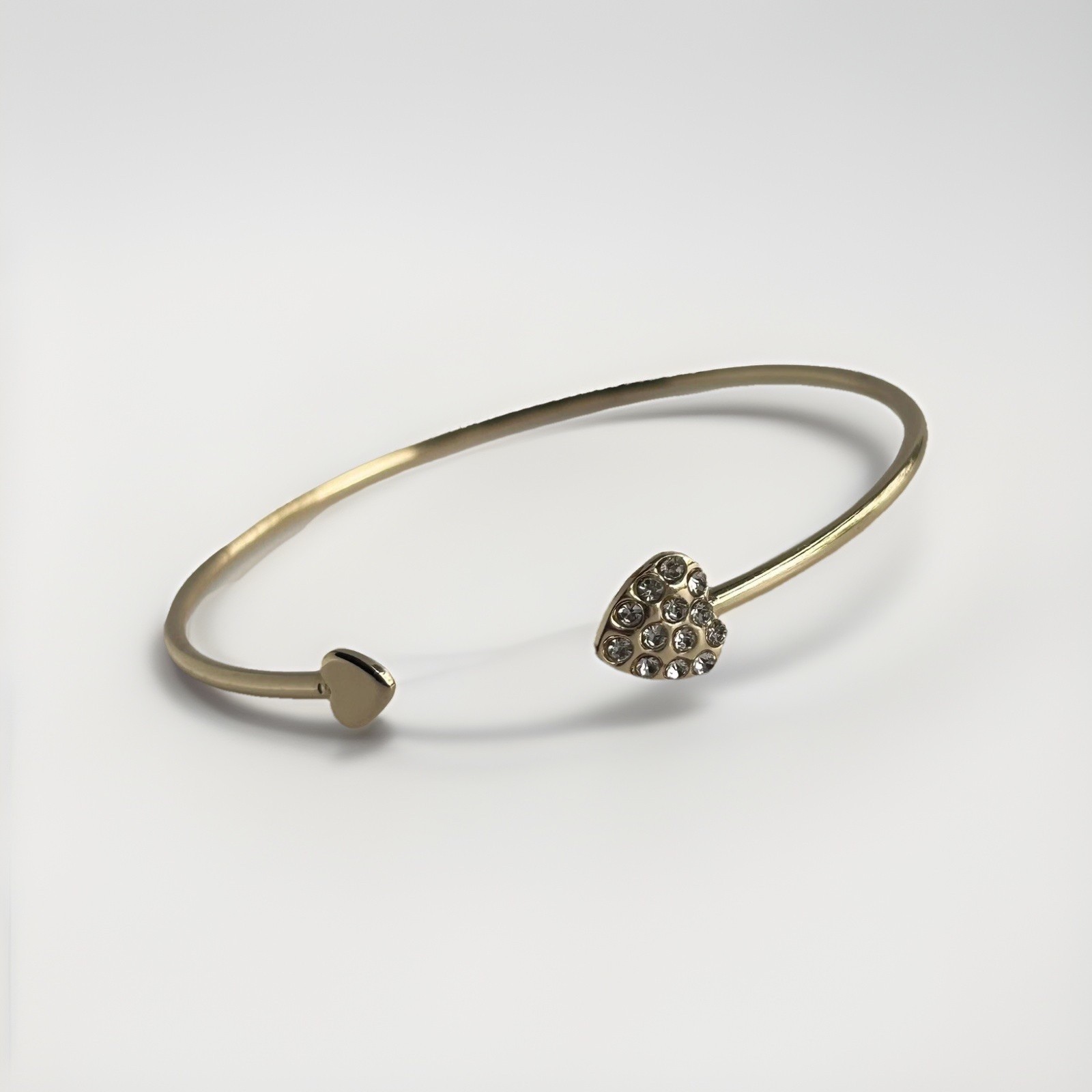 Gold Tone Open Cuff Bracelet (Bangle Style) with CZ Heart Ends