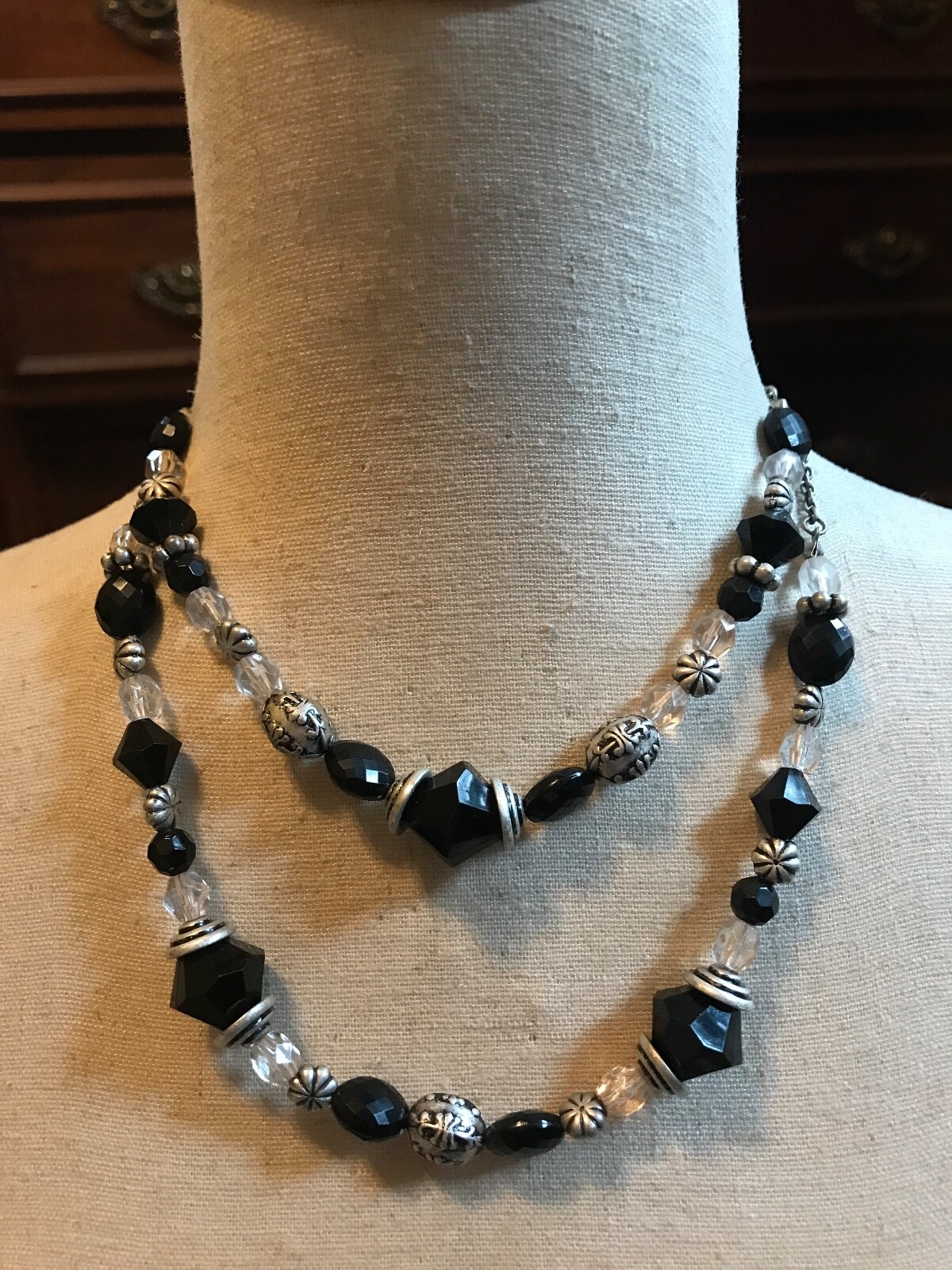 DOUBLE STRAND OF BLACK AND CLEAR PLASTIC AND METAL BEADED NECKLACE 15″