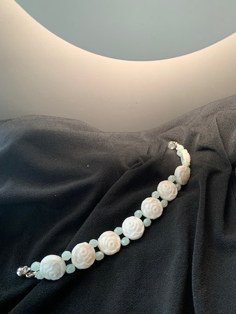 White rose milk glass bracelet with jade color accent beads and magnetic clasp.