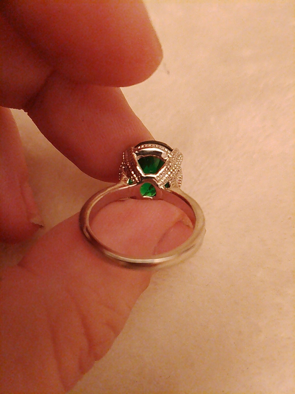 SizeUK J and USA 4.5 Possibly silver Green oval cut claw set ring