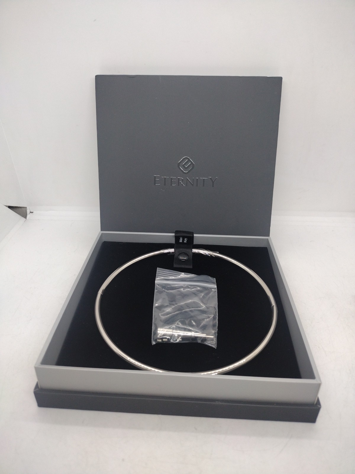 16 Inch 6mm Petite Polished Locking Eternity Collar Titanium With Key Opened Box