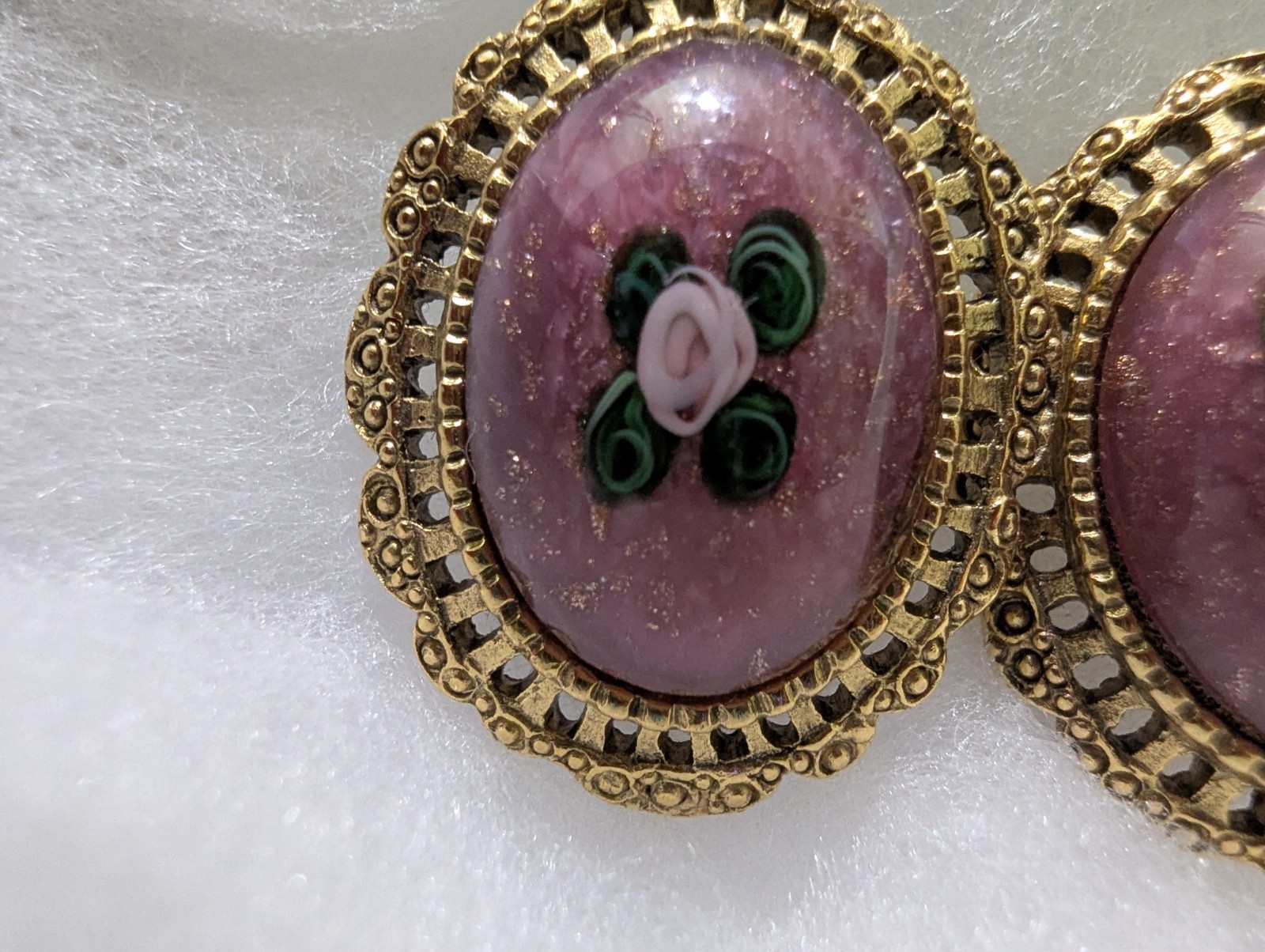 Gold Colored Filigree Earrings With Flower And Leaves Surrounded By Purple