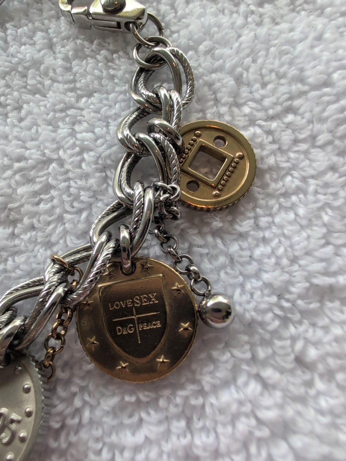 Dolce gabbana bracelet With 15 charms great condition, 8.5″ long Heavy Piece