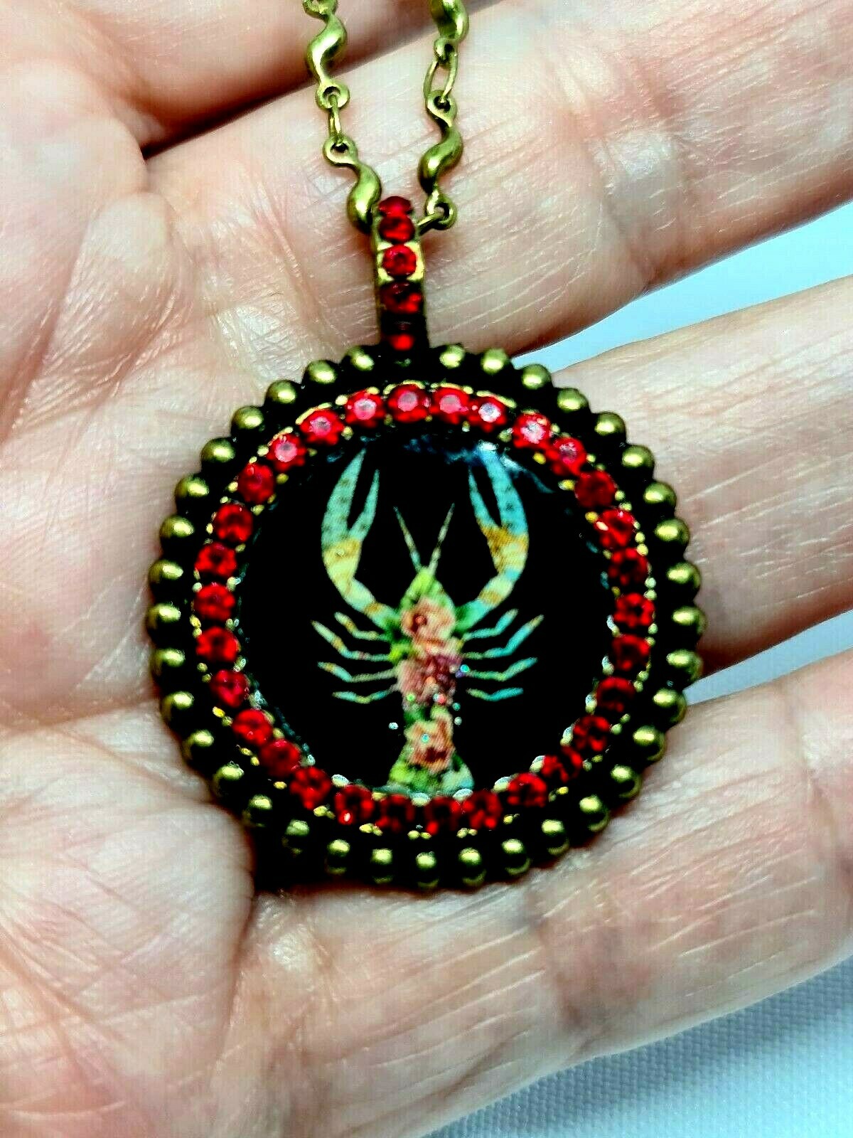 Lovely round Metal Necklace By Michal Negrin Red Crystal Cancer Sign.