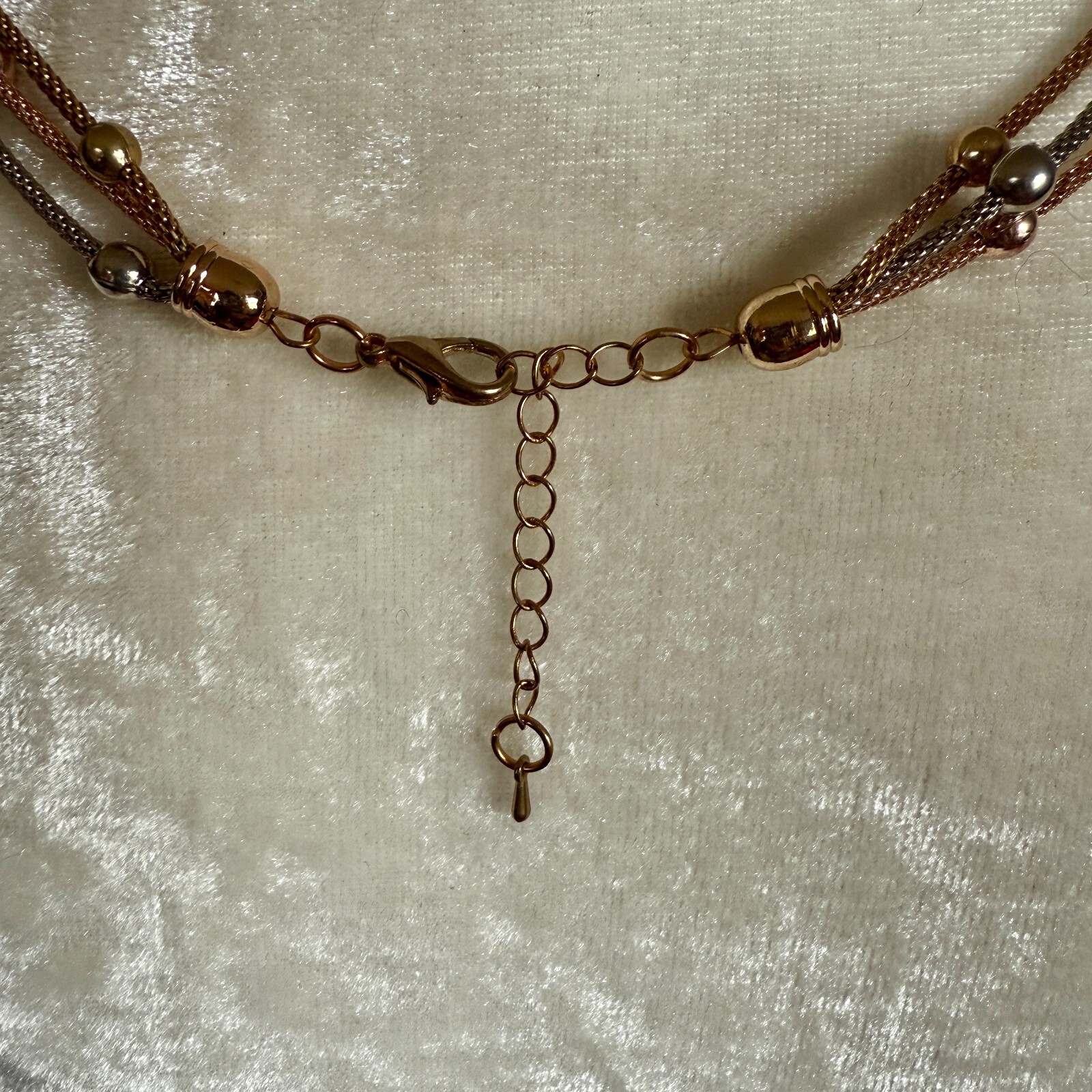 Gold and silver rope chain with gold and silver beads and lobster claw closure