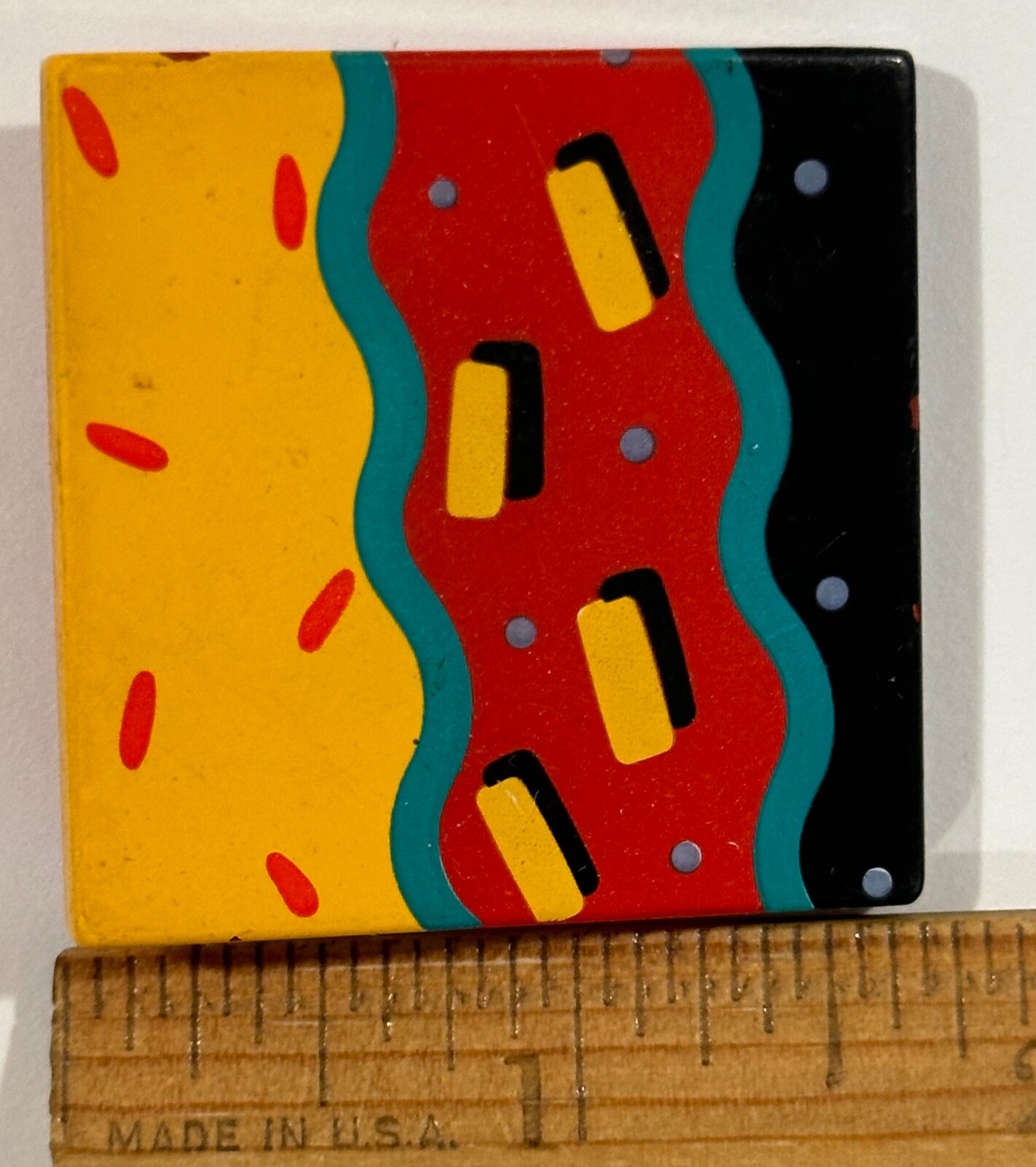 Square abstract graphic pin vibrant colors circa 1980s simple gorgeous