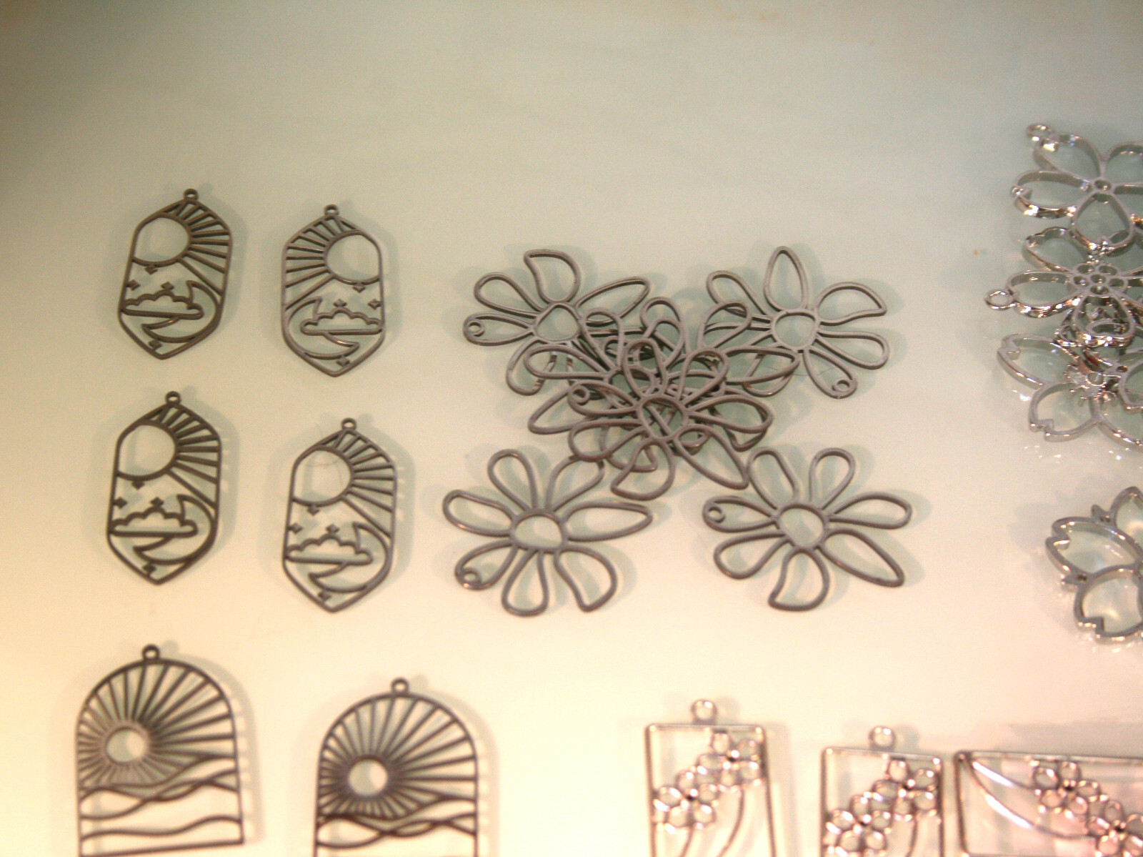 Stainless steel hollow style earring bases, various designs 43 total pieces