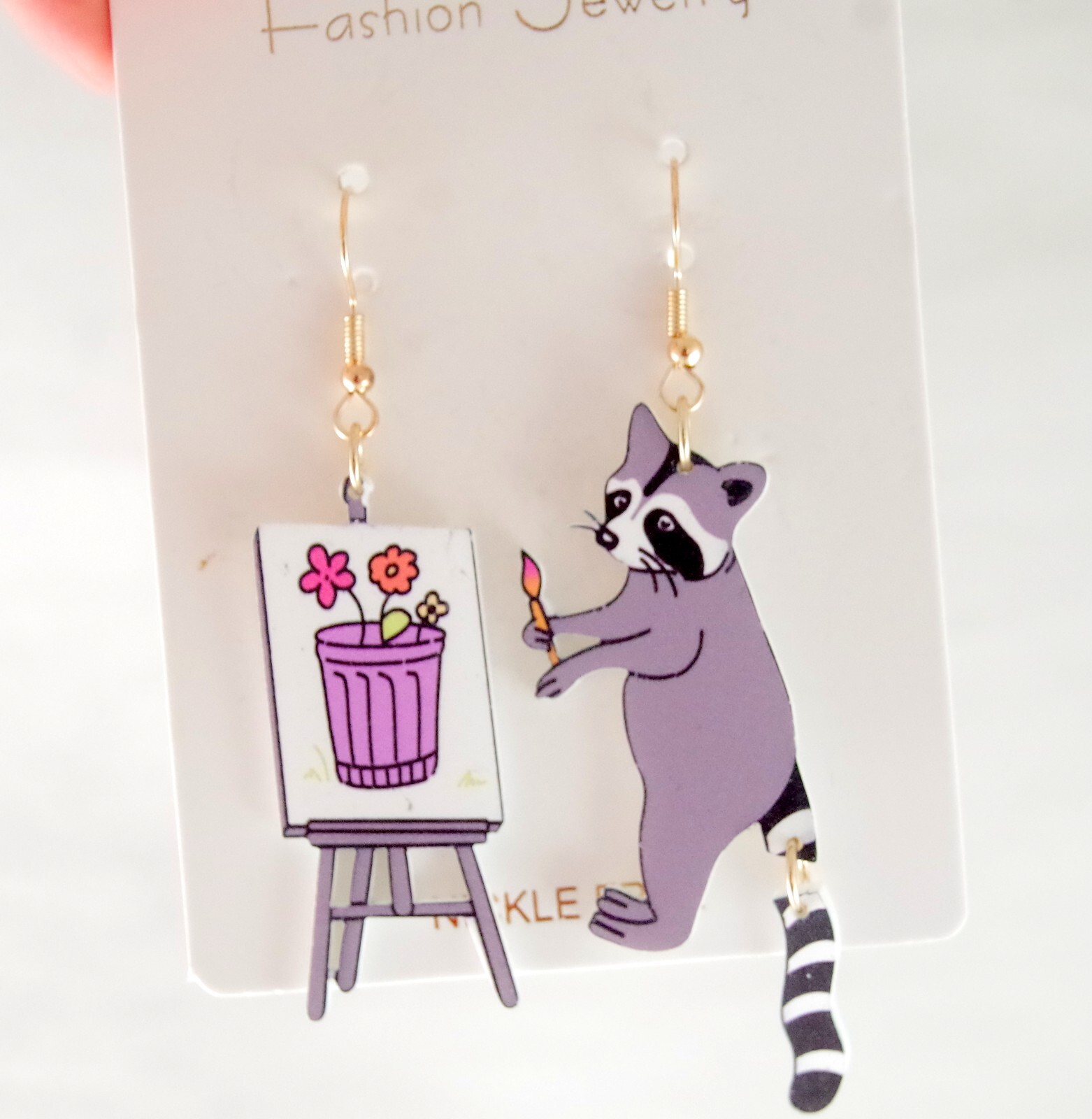 ASYMMETRICAL RACOON ARTIST PAINTING FLOWERS IN GARBAGE CAN ACRYLIC DROP EARRINGS