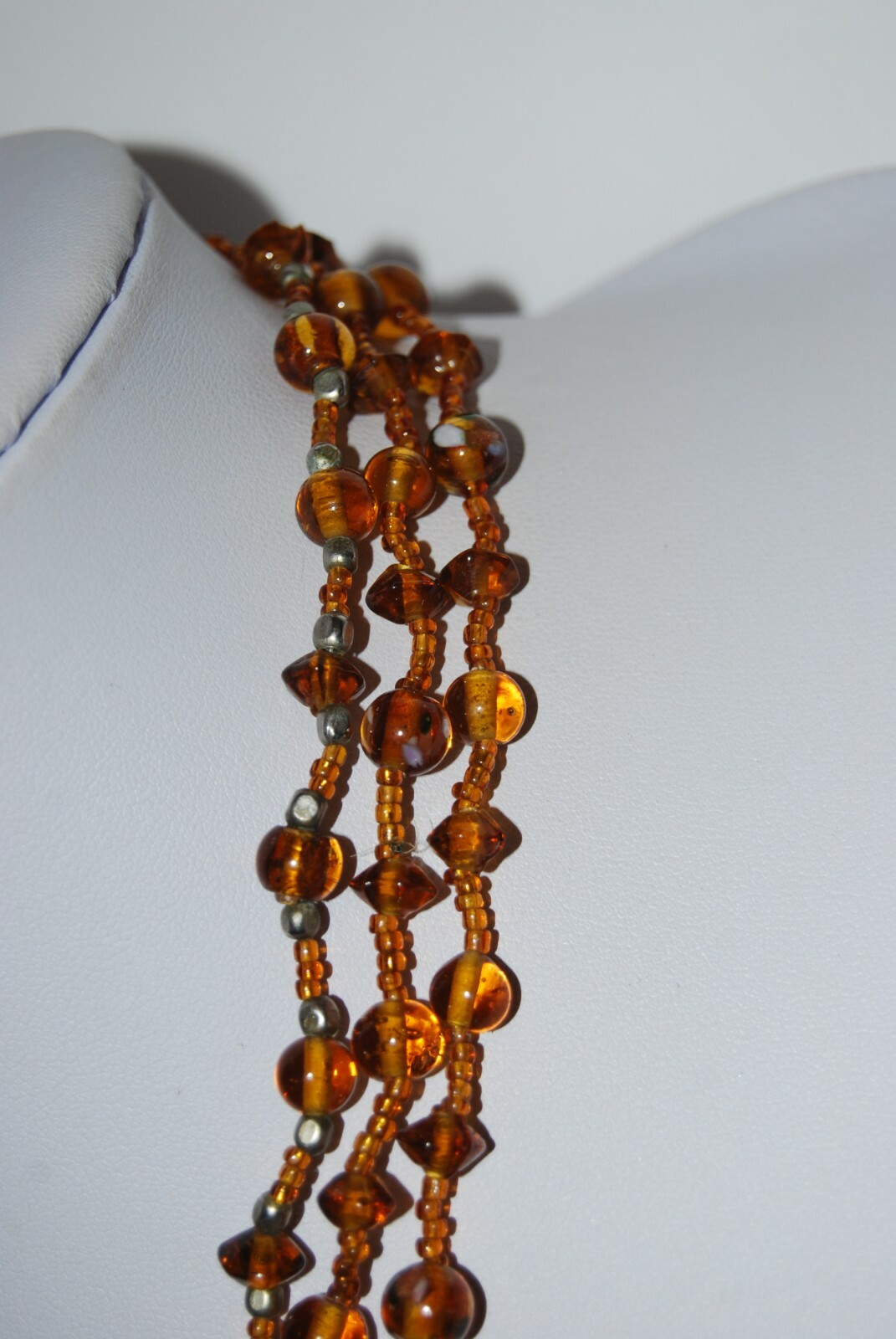 MULTI STRAND AMBER COLOR GLASS WITH LARGE GRIPOIX PENDANT STATEMENT NECKLACE