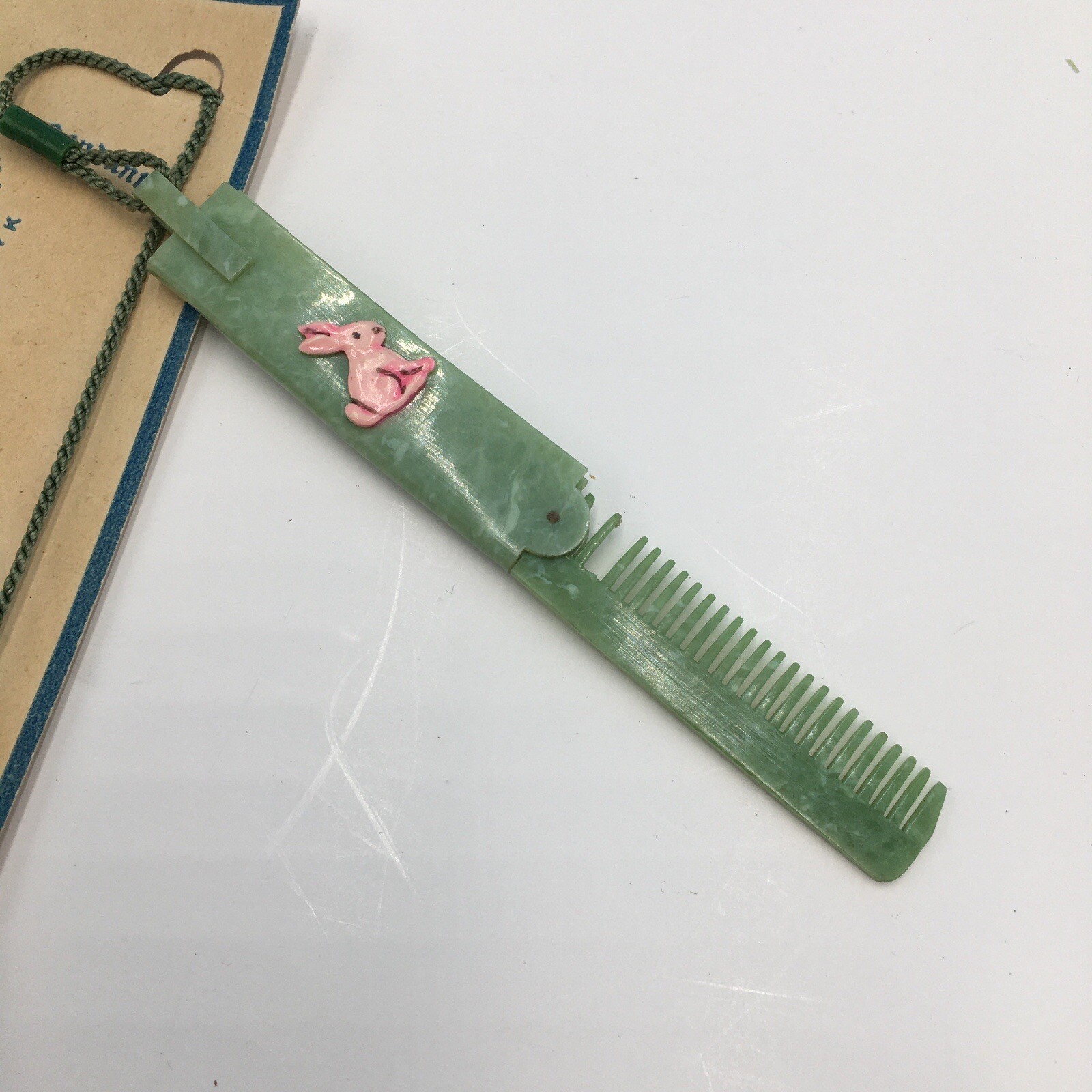 Vintage Easter Bunny green celluoid fold out Comb Childs Mother Goose Pendant