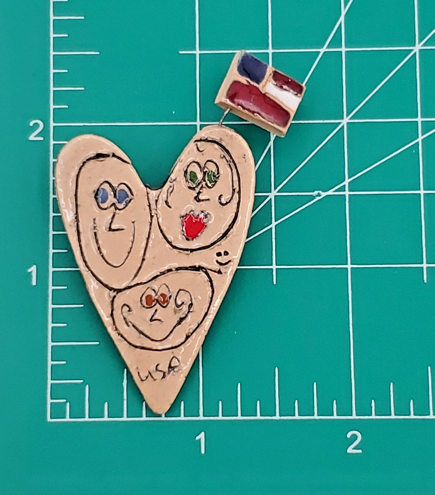 VTG Heart Brooch 2.25in Tan Porcelain Hand Crafted Floating Flag Faces USA Pin