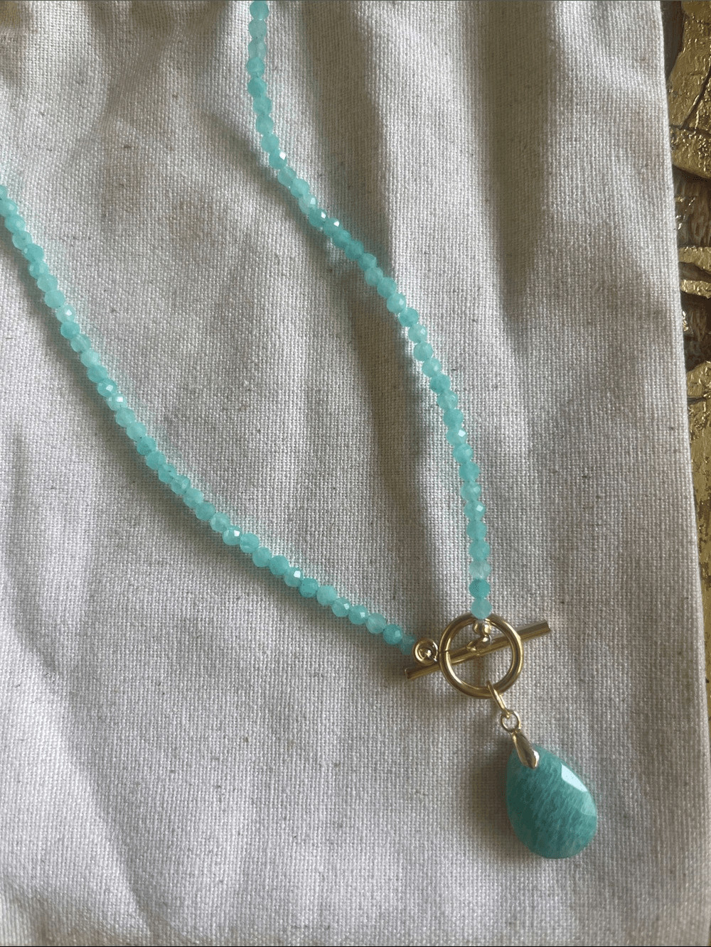 Teal Faceted Bead Necklace with Teardrop Pendant