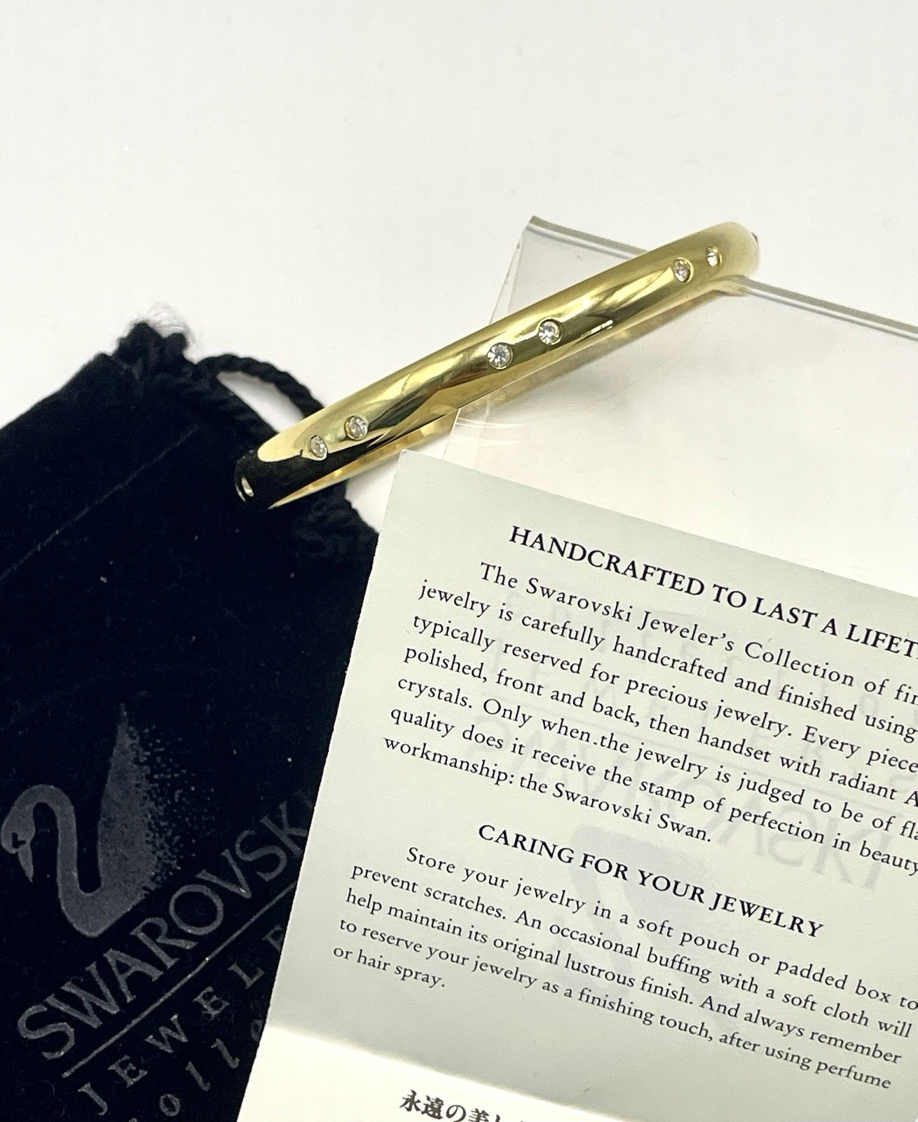 Swarovski Gold Tone Bangle Bracelet with Scattered Crystal Accents Swan Logo