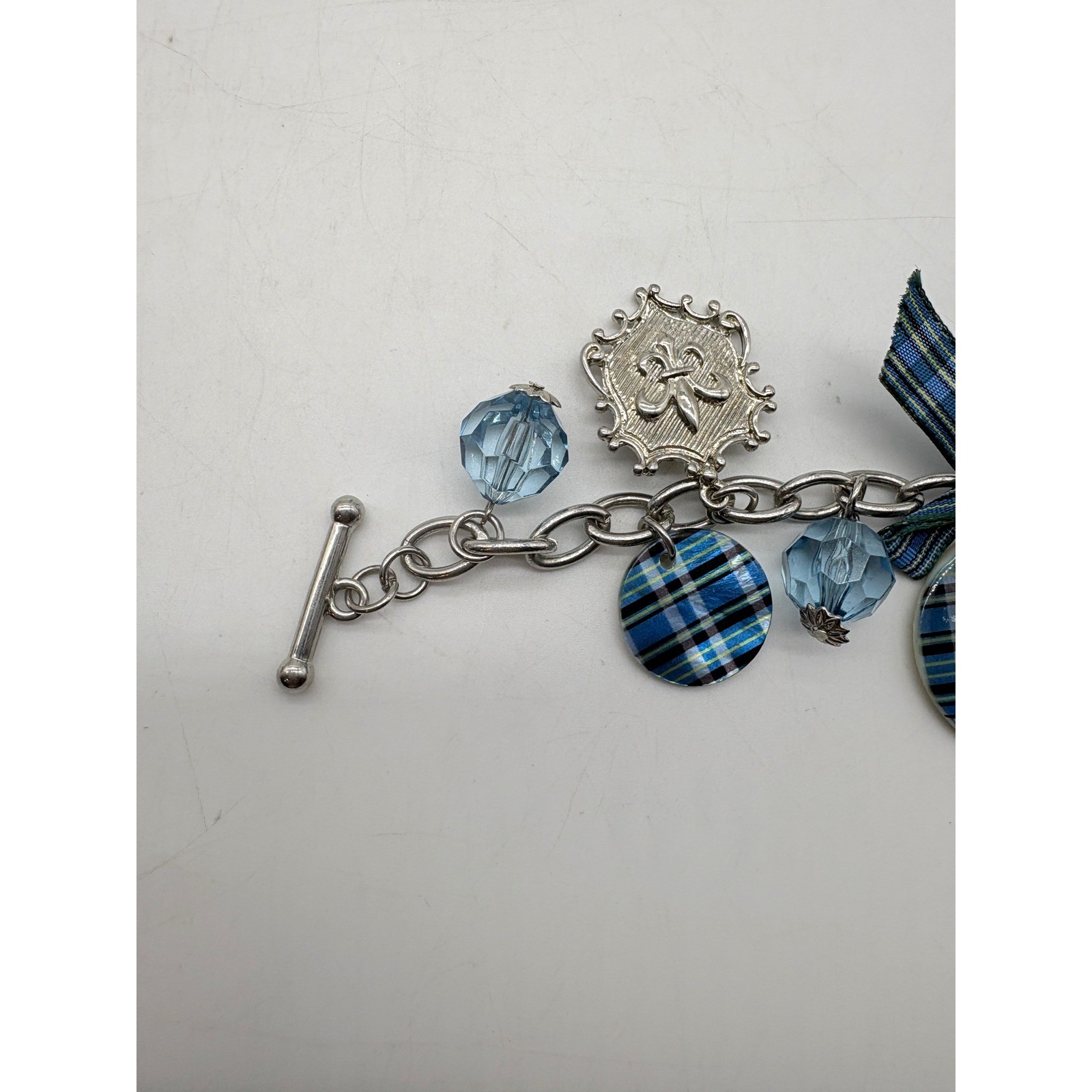 Blue Plaid Fleur De Lis Charm Bracelet Silver Tone Toggle Clasp Glass Bead Bow