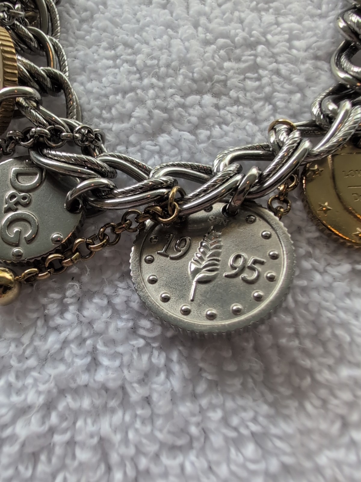 Dolce gabbana bracelet With 15 charms great condition, 8.5″ long Heavy Piece
