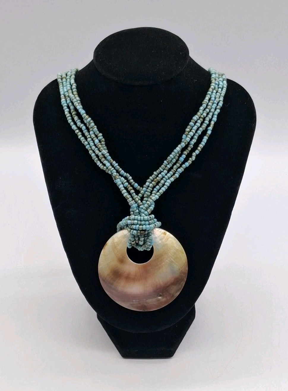 Santa Fe Style Turquoise Color Bead Four Strand Necklace with Shell Centerpiece