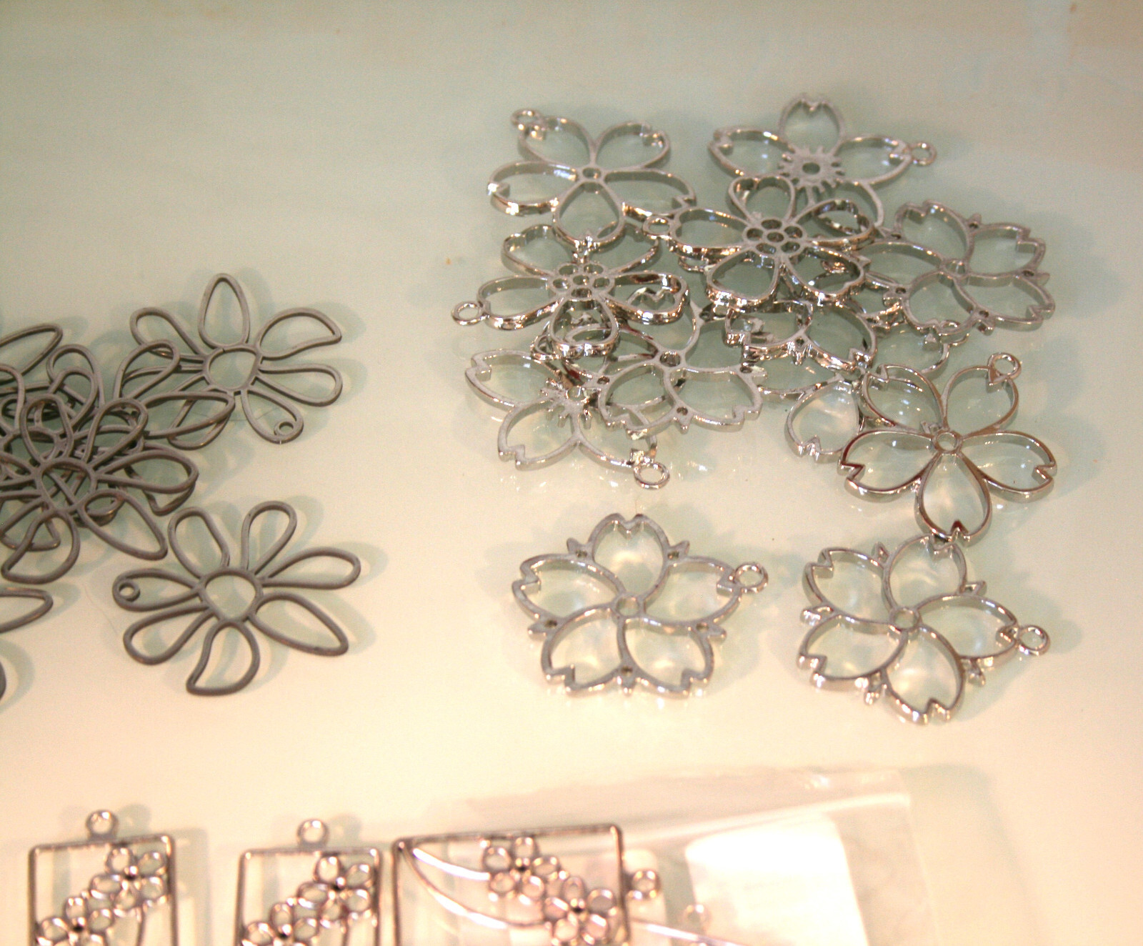 Stainless steel hollow style earring bases, various designs 43 total pieces