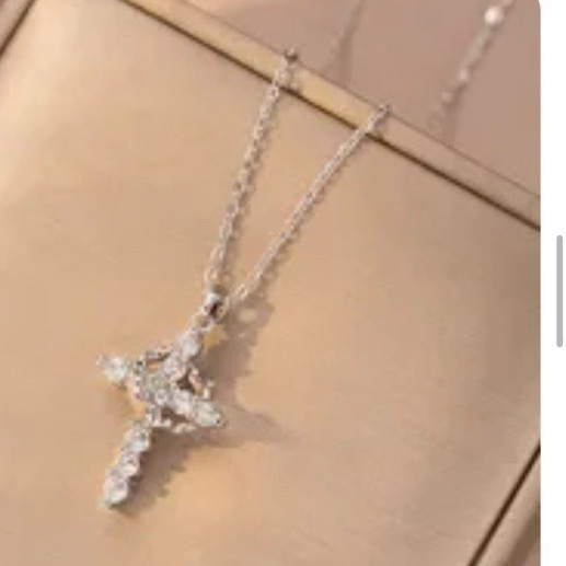 Rotatable crown and cross necklace