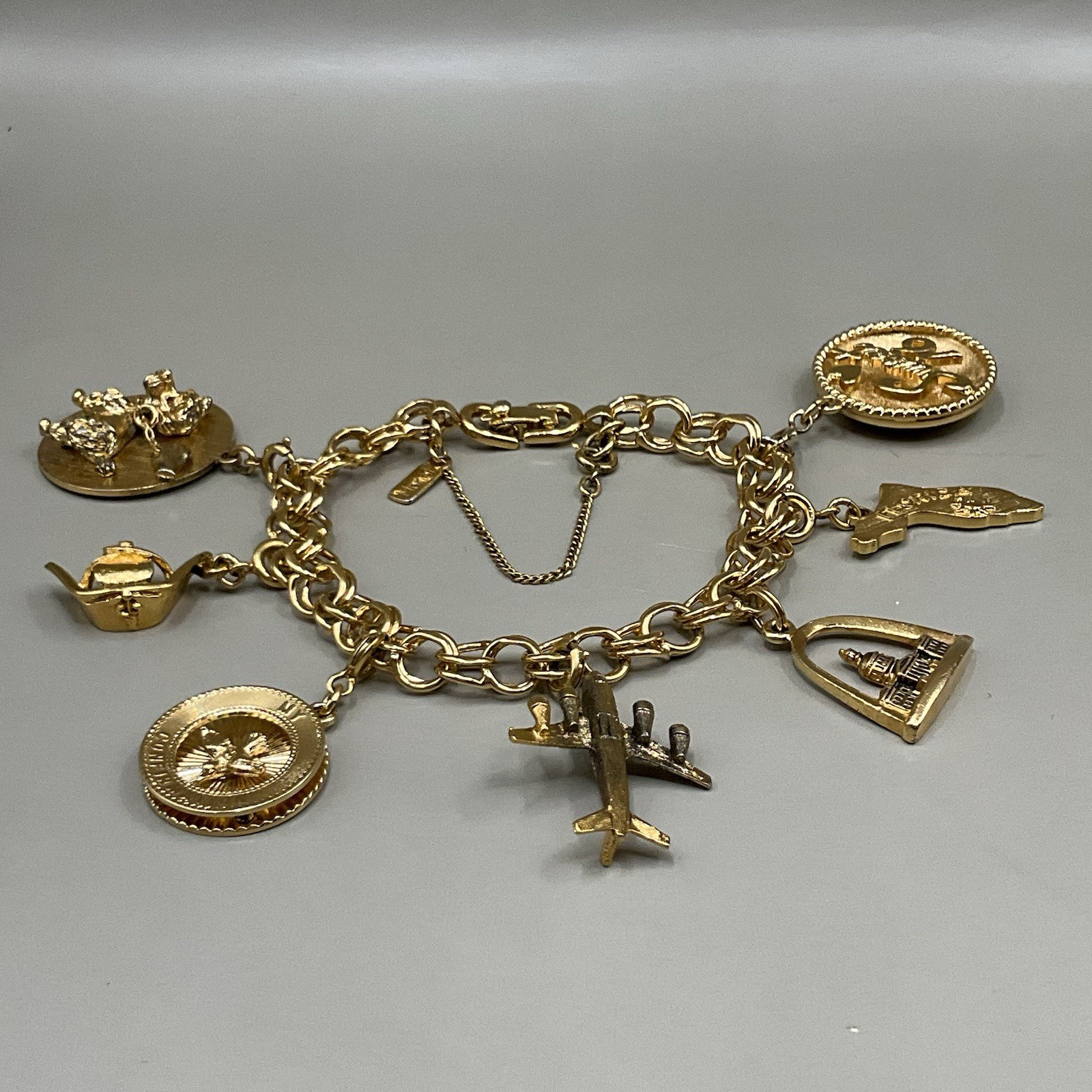 Monet Women’s 7 Charm Bracelet Gold Tone Travel Birthday Puppy Travel Communion