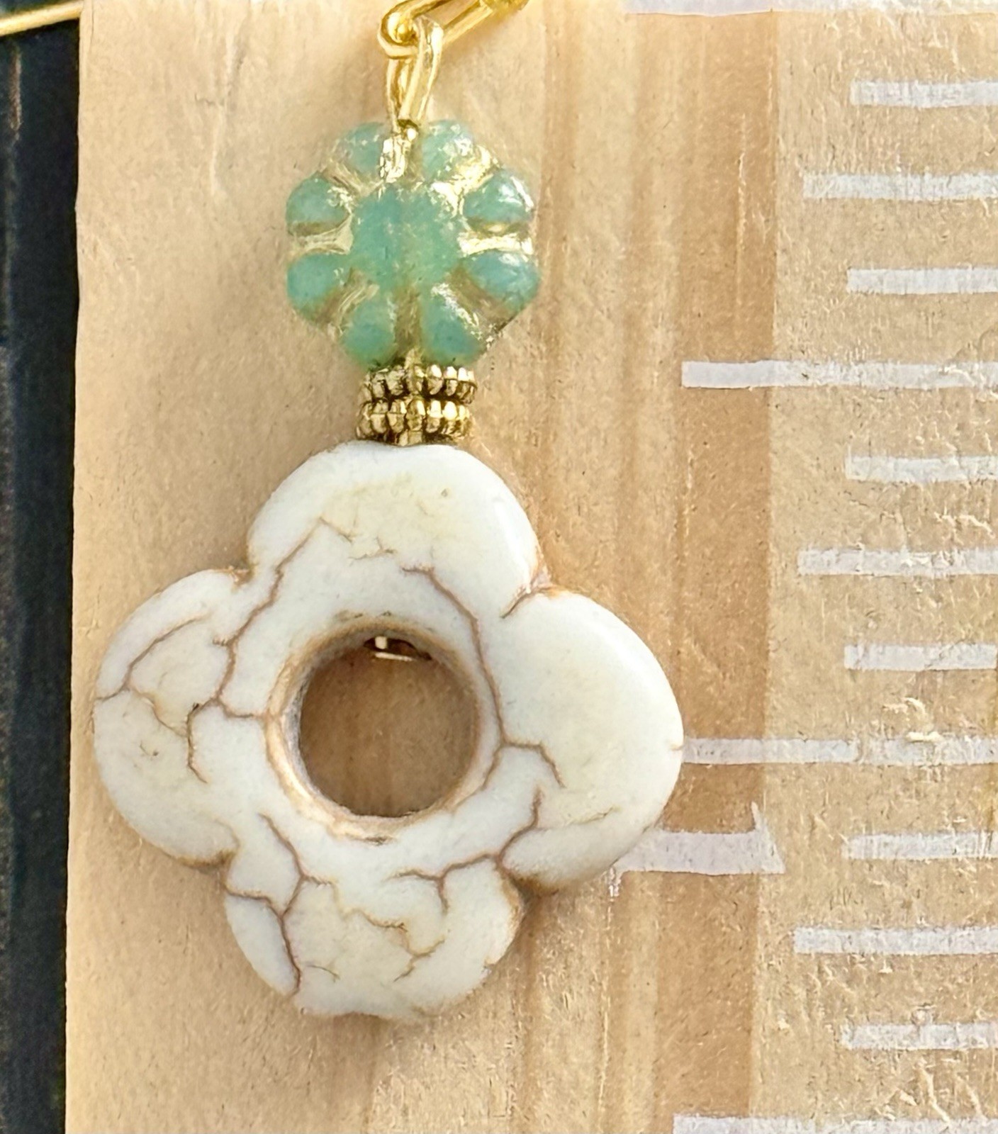 Gold with Green Glass Bead and Ivory Howlite Flower. Clover