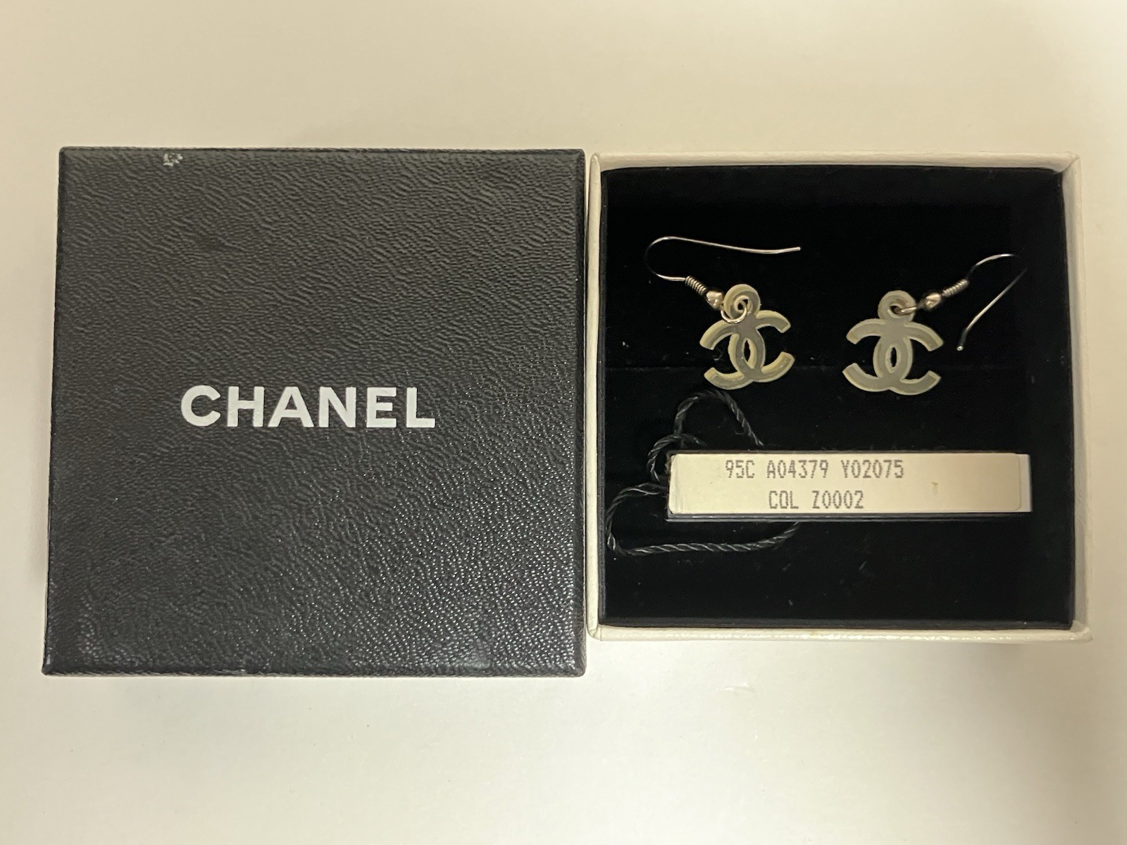 Authentic Vintage CHANEL CC Logo Resin Hook Earrings 95C Cruise Ivory w/ Box