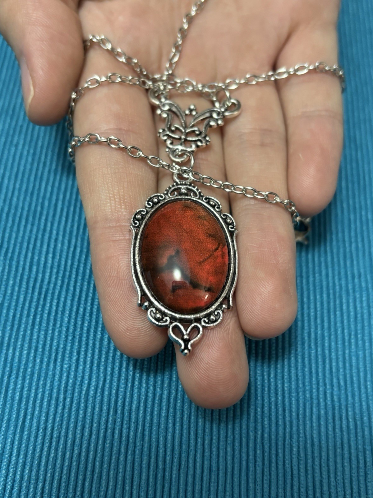 Blood red pendant silver tone chain necklace