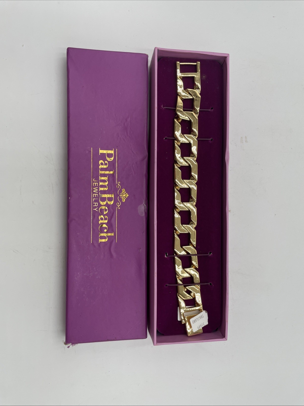 Palm Beach Jewelry brand bracelet is a gold-toned curb chain bracelet