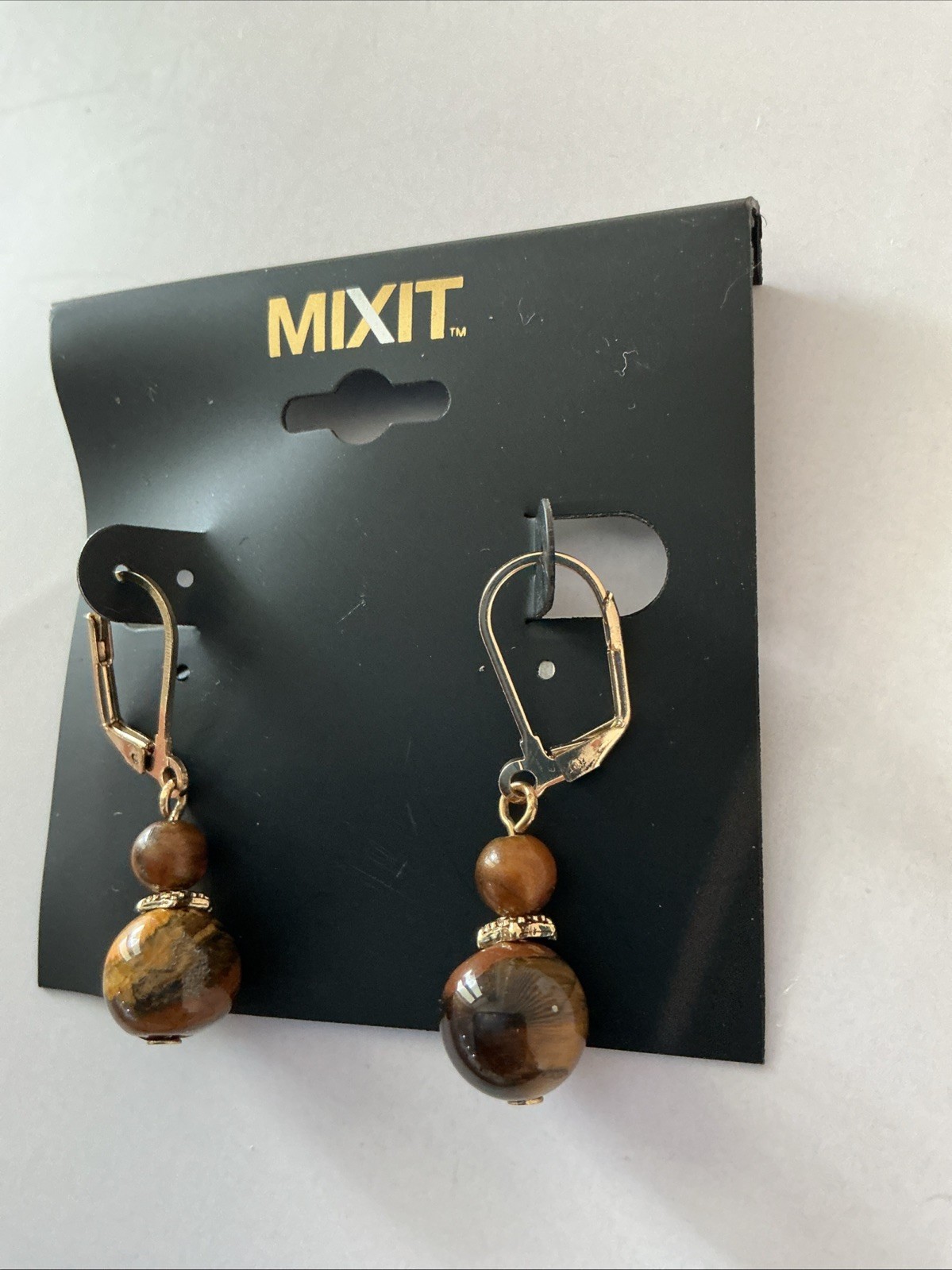 Mixit leverback drop earrings feature tiger eye stone beads and a gold-toned