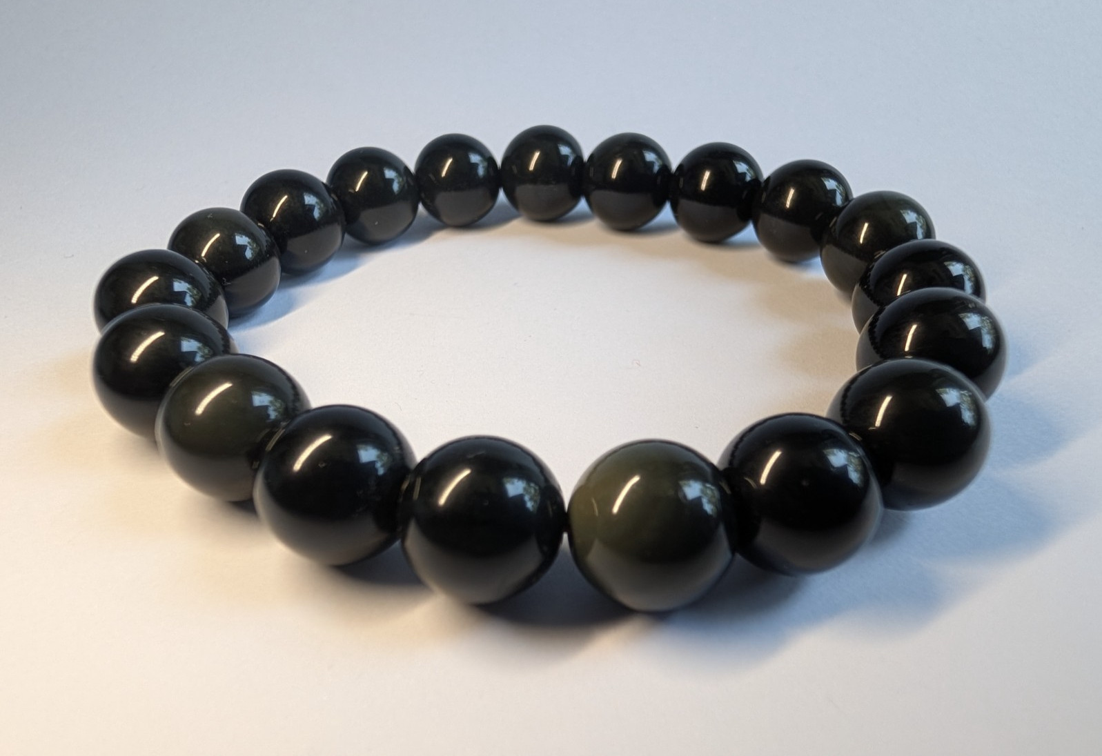 Obsidian Silver, Gold, Green, Purple Sheened Polished Bead Stretch Bracelet