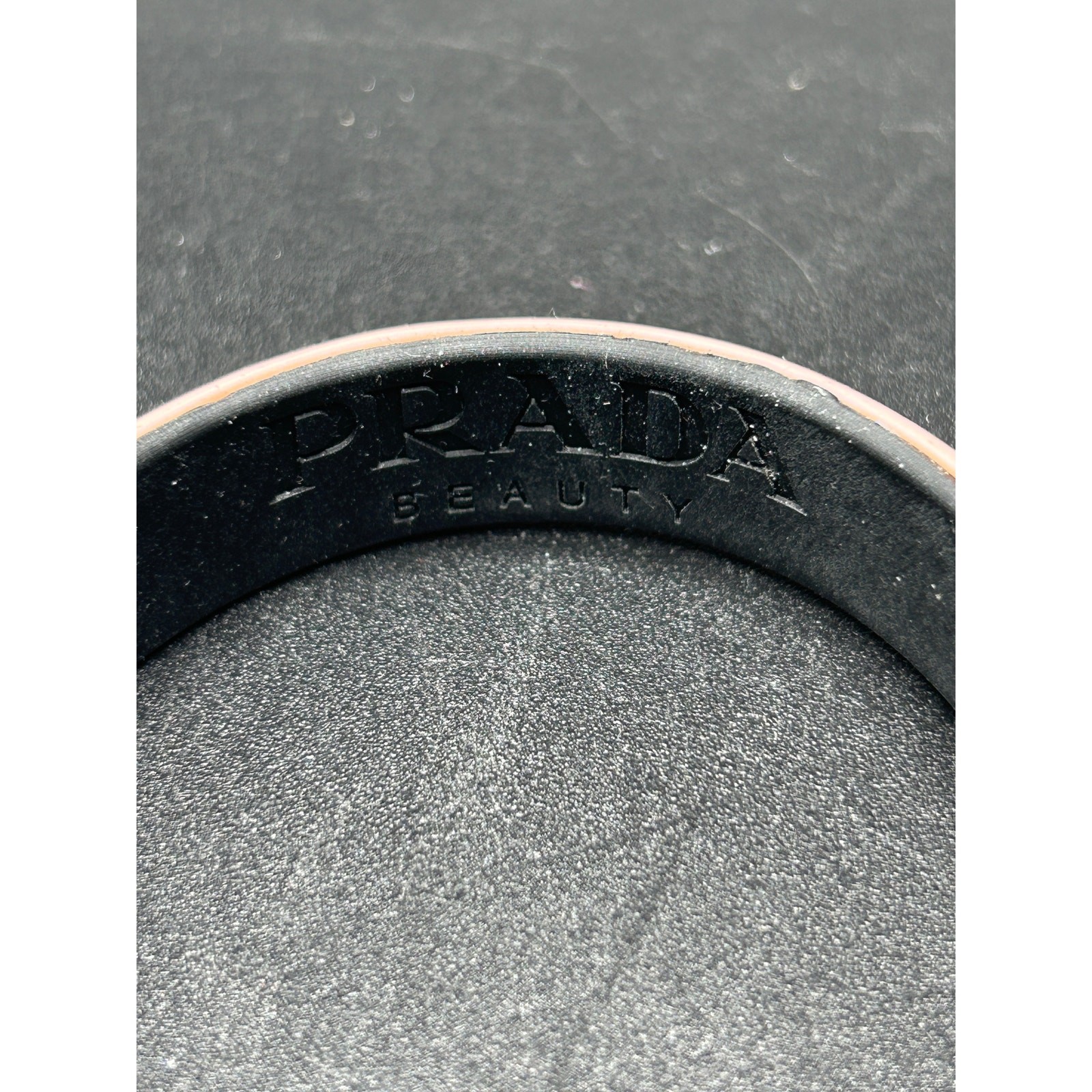 Reversible Prada Beauty pink plastic bracelet