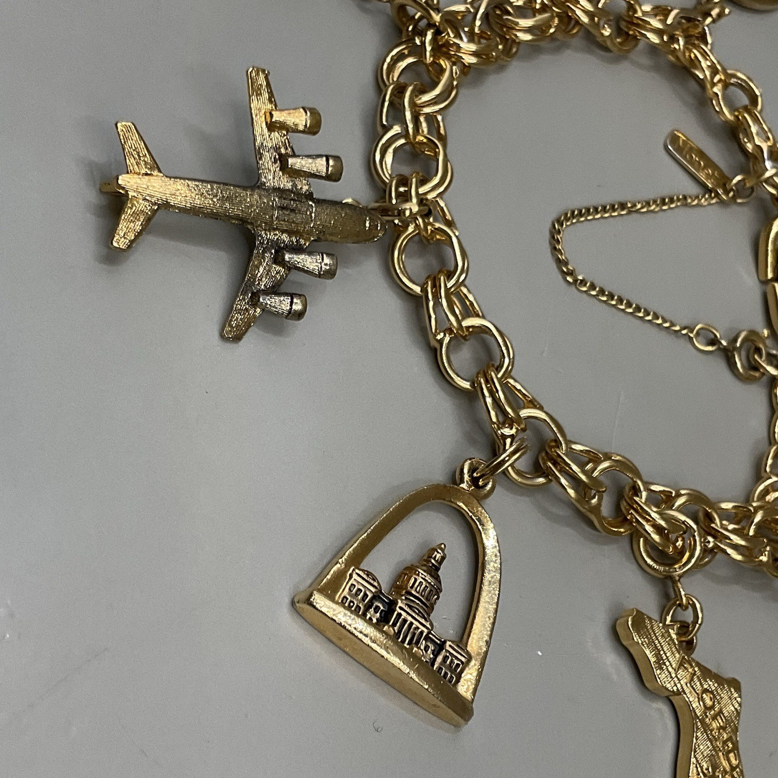 Monet Women’s 7 Charm Bracelet Gold Tone Travel Birthday Puppy Travel Communion