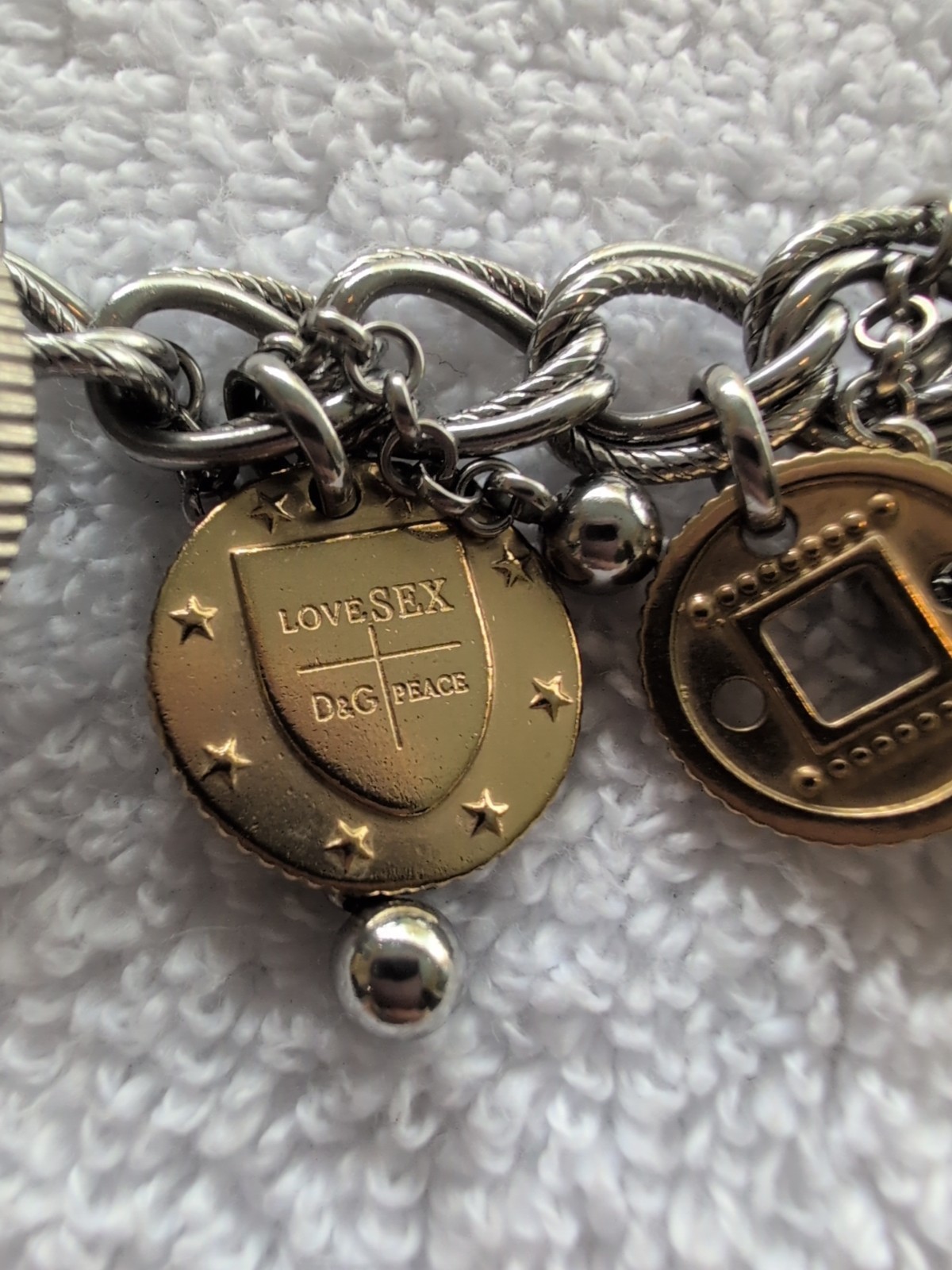 Dolce gabbana bracelet With 15 charms great condition, 8.5″ long Heavy Piece