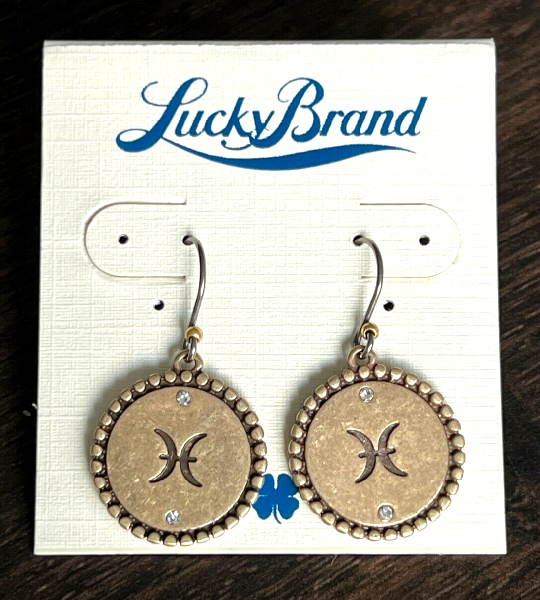 Lucky Brand brass plated crystal Pisces earrings.