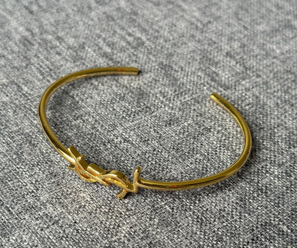 Saint Laurent YSL Gold Tone Open Bangle Logo Cuff Bracelet Designer Luxury