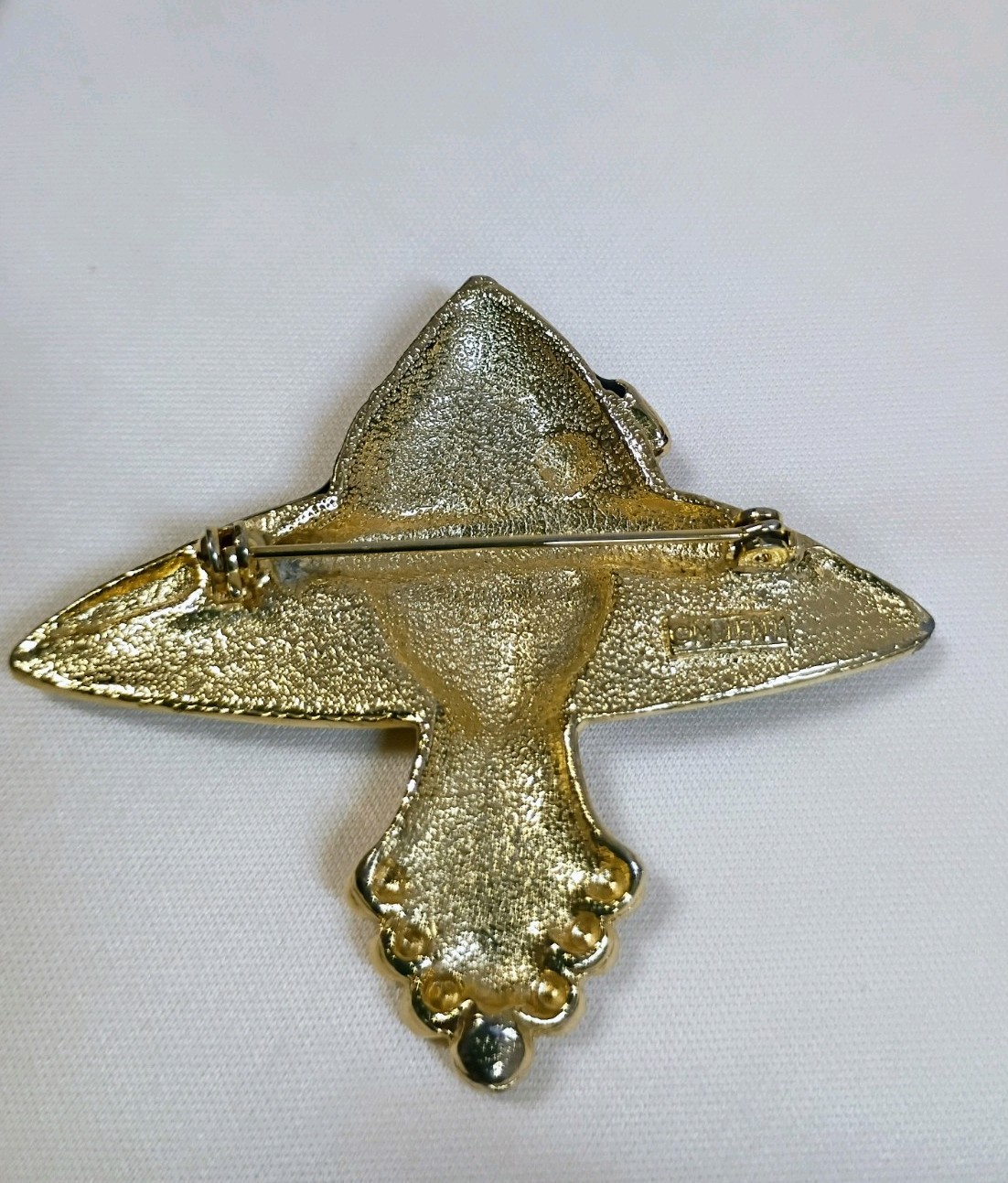 Vintage M J ENT gold-tone and black enamel lady hat brooch
