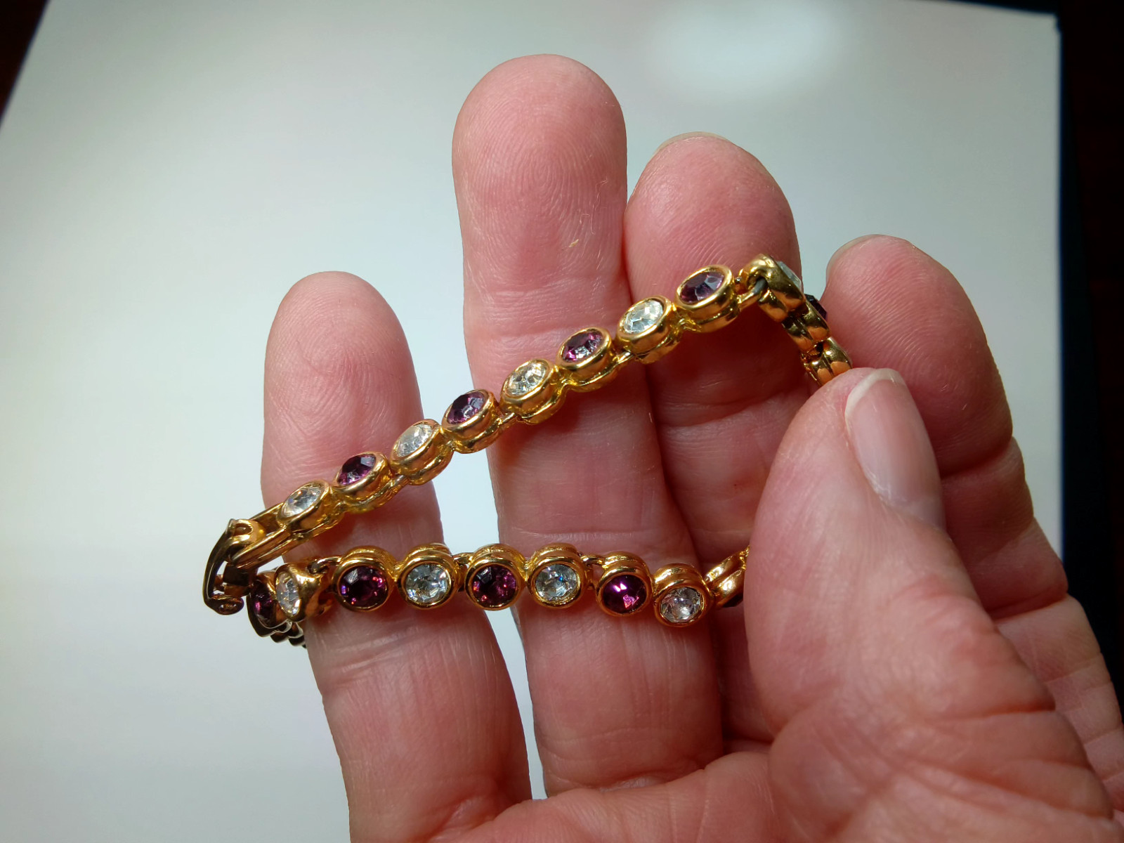 Gold Tone Tennis Bracelet with Alternating Clear and Purple Rhinestoness