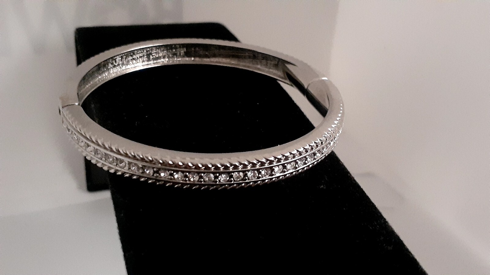 Cubic Zirconia Silvertone Bangle Bracelet. Magnetic closure. Signed China