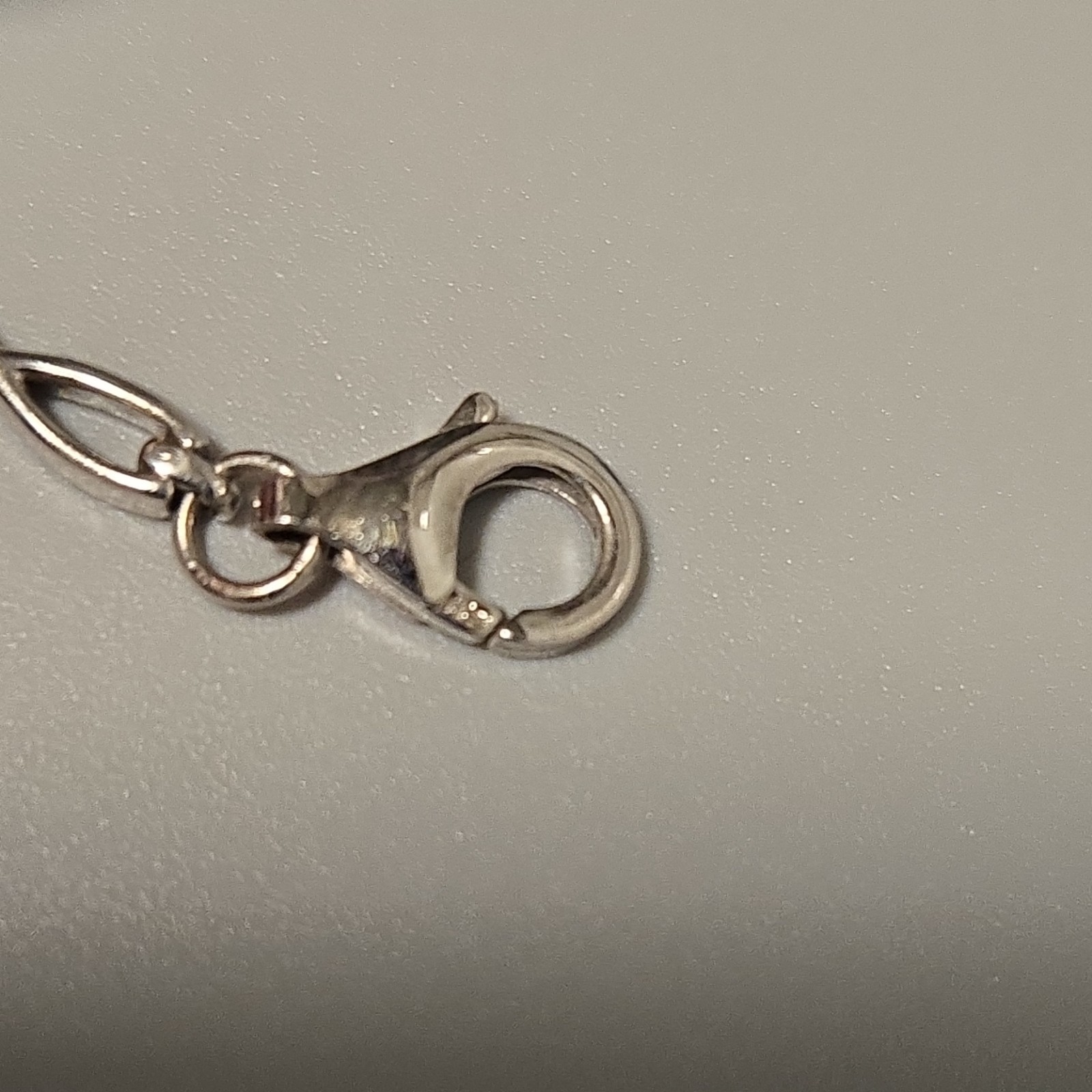 Silver Tennis Bracelet with Red Oval Stones, Lobster Closure, Prong Setting