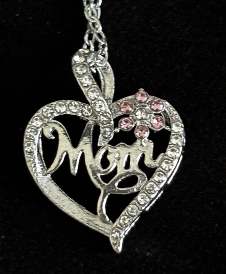Mom’s “love” in slvr Heart w halo diamonds & pink flower accents/ w velvet pouch
