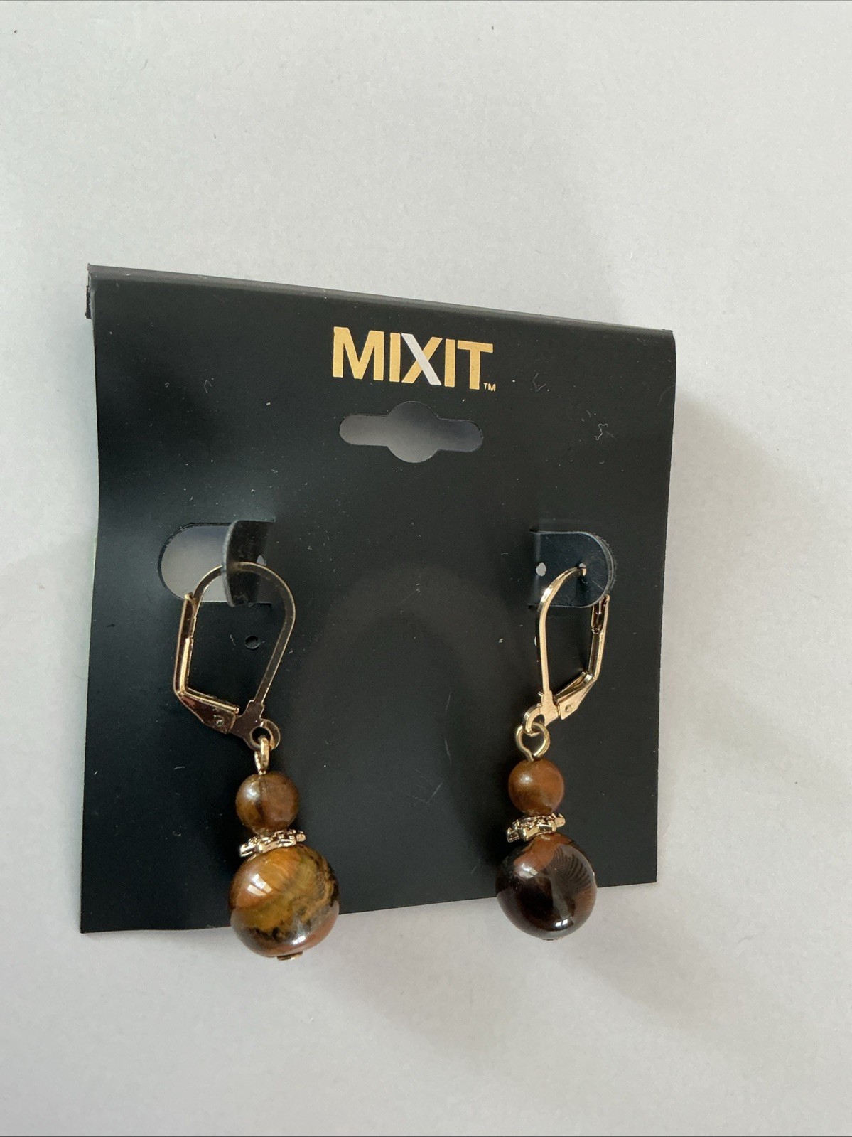 Mixit leverback drop earrings feature tiger eye stone beads and a gold-toned