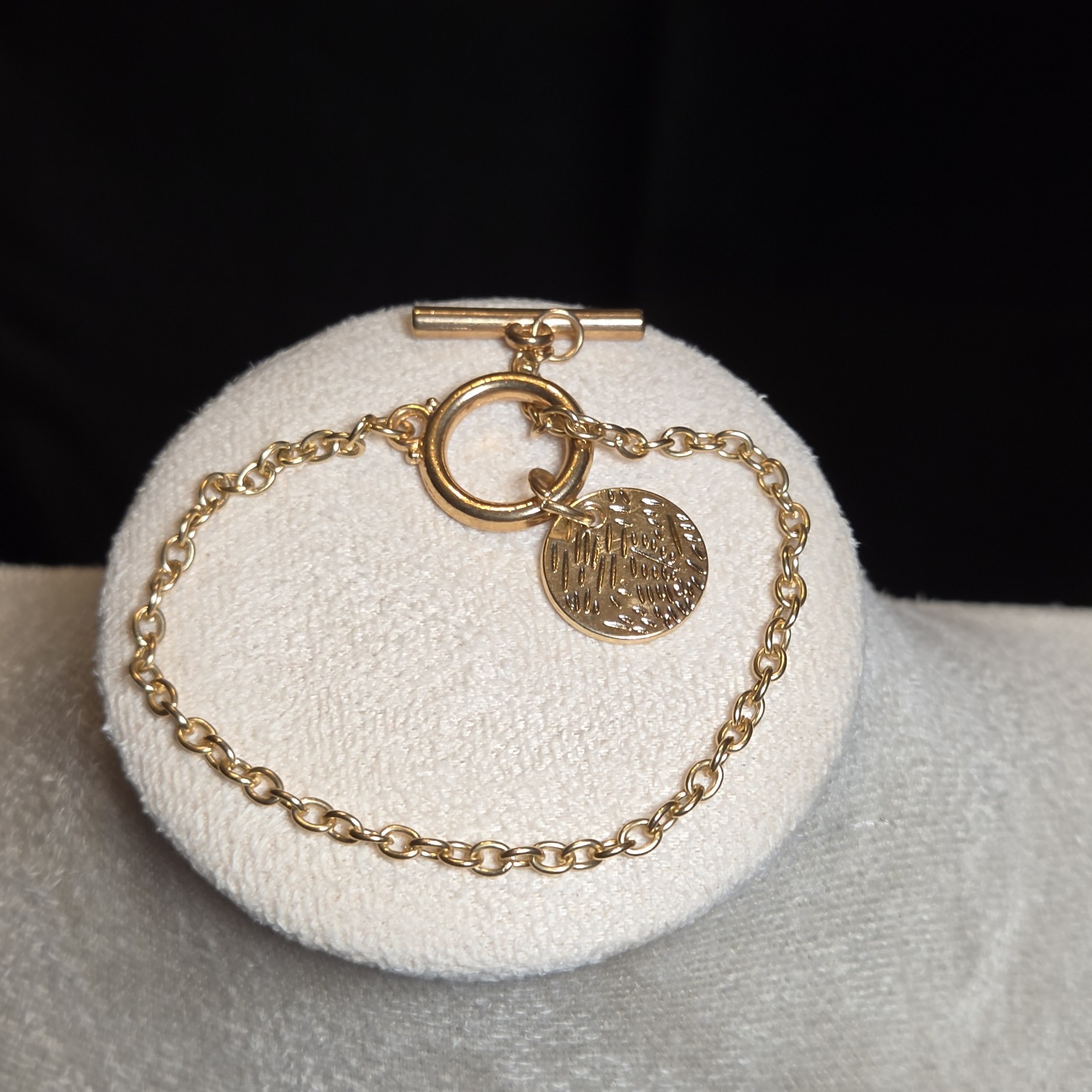 Elegant Gold-tone Bracelet With Toggle Clasp And Engraved Charm Accent