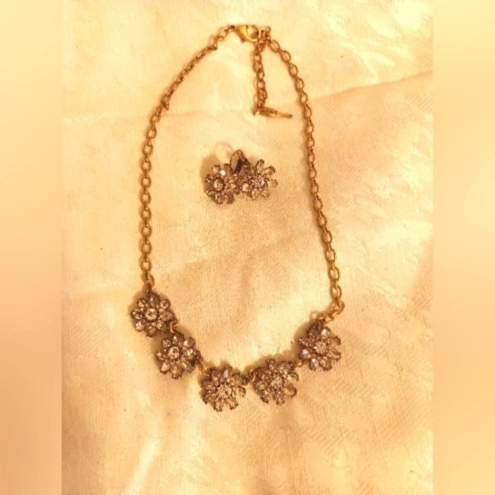 Chloe+Isabel flower rhinestone necklace and earring set. Antique gold