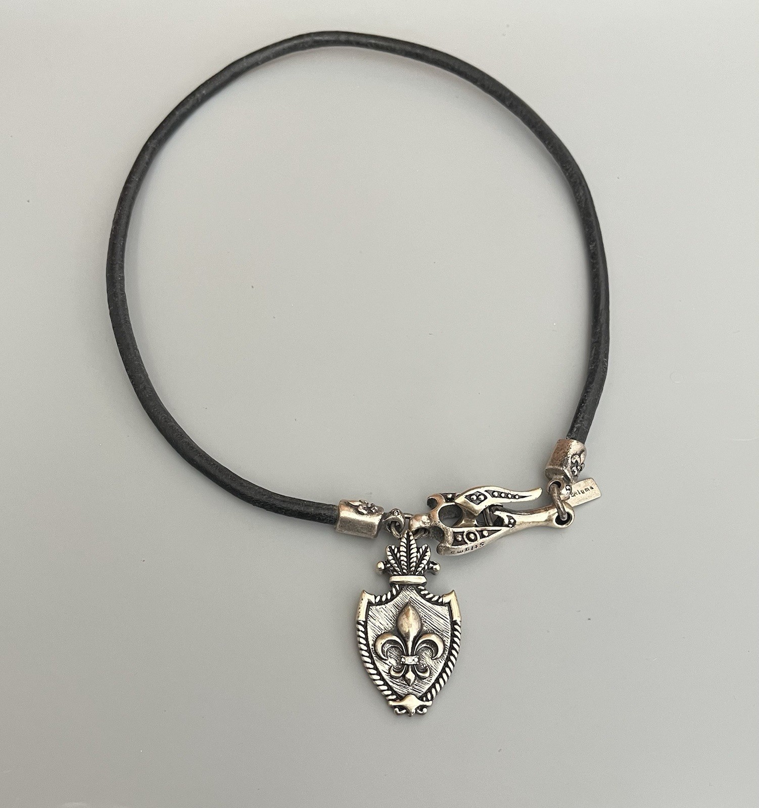 Signed STIGMA Black Rope Necklace Silver Tone Shield Fleur De Lis Pendant 21”